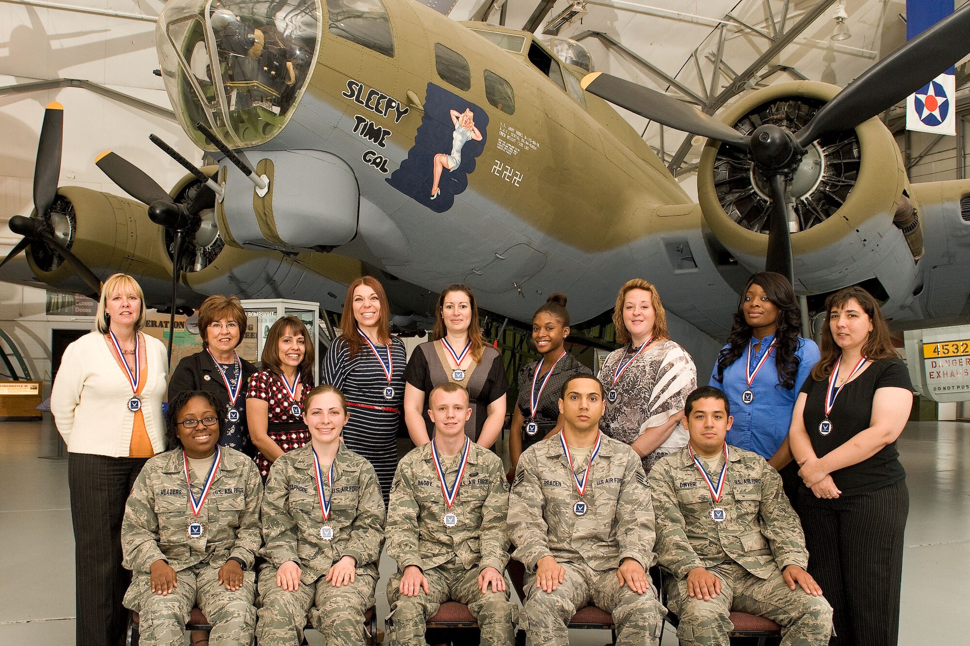 Service members and civilians are recognized April 20, 2012, at the Air Mobility Command Museum at Dover Air Force Base, Del., for outstanding service to Dover AFB and the local community. Col. James Mercer, 436th Airlift Wing vice wing commander, presented 31 volunteers with certificates and medals during the 2012 Volunteer Excellence Award Ceremony. The winners in this year’s Volunteer Excellence Award category for longevity were Perry Bratcher, Kimberly Landis and Bobby Bible. The Angel Award winners were Sandy Roddy, Kathy McNulty, Joyce Ford, Staff Sgt. Deondra Braden, Tina Veves and Quinneisha Brooks. (U.S. Air Force photo by Roland Balik)