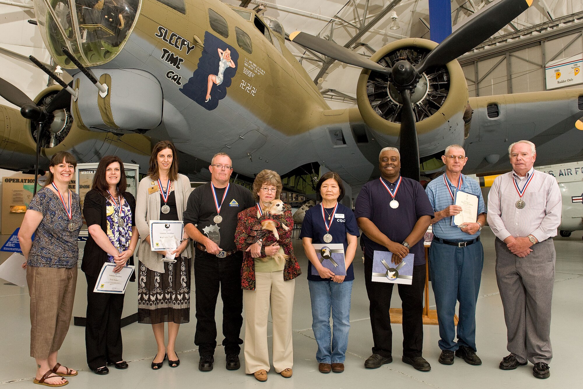 Service members and civilians are recognized April 20, 2012, at the Air Mobility Command Museum at Dover Air Force Base, Del., for outstanding service to Dover AFB and the local community. Col. James Mercer, 436th Airlift Wing vice wing commander, presented 31 volunteers with certificates and medals during the 2012 Volunteer Excellence Award Ceremony. The winners in this year’s Volunteer Excellence Award category for longevity were Perry Bratcher, Kimberly Landis and Bobby Bible. The Angel Award winners were Sandy Roddy, Kathy McNulty, Joyce Ford, Staff Sgt. Deondra Braden, Tina Veves and Quinneisha Brooks. (U.S. Air Force photo by Roland Balik)