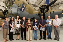 Service members and civilians are recognized April 20, 2012, at the Air Mobility Command Museum at Dover Air Force Base, Del., for outstanding service to Dover AFB and the local community. Col. James Mercer, 436th Airlift Wing vice wing commander, presented 31 volunteers with certificates and medals during the 2012 Volunteer Excellence Award Ceremony. The winners in this year’s Volunteer Excellence Award category for longevity were Perry Bratcher, Kimberly Landis and Bobby Bible. The Angel Award winners were Sandy Roddy, Kathy McNulty, Joyce Ford, Staff Sgt. Deondra Braden, Tina Veves and Quinneisha Brooks. (U.S. Air Force photo by Roland Balik)