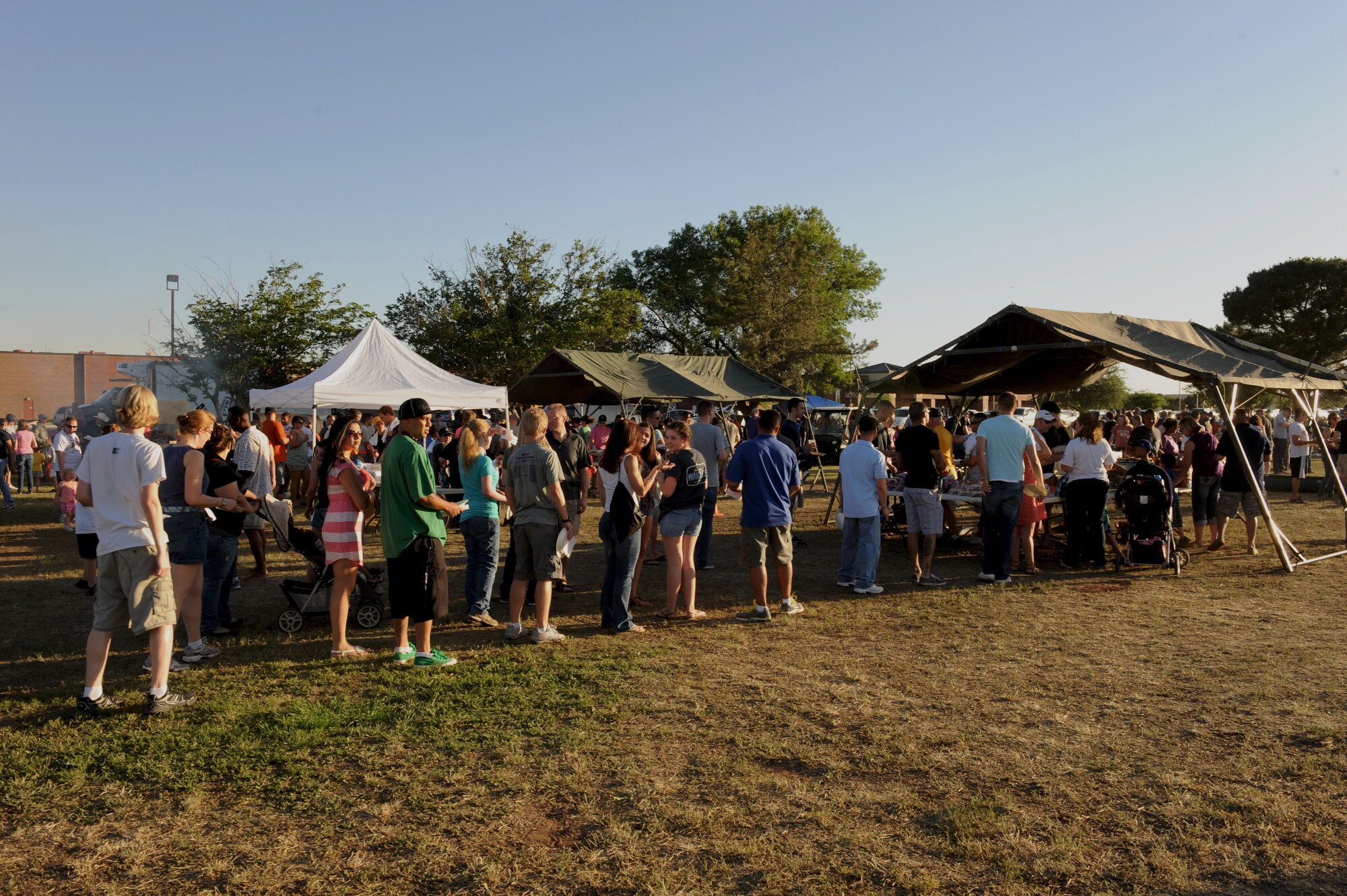 Base personnel and their families wait in line for food during the Rockin’ in the Park festival April 27, 2012, at Dyess Air Force Base, Texas. The festival offered free food and live entertainment to all military members, base civilian employees and family members. (U.S. Air Force photo by Staff Sgt. Richard P. Ebensberger/ Released)