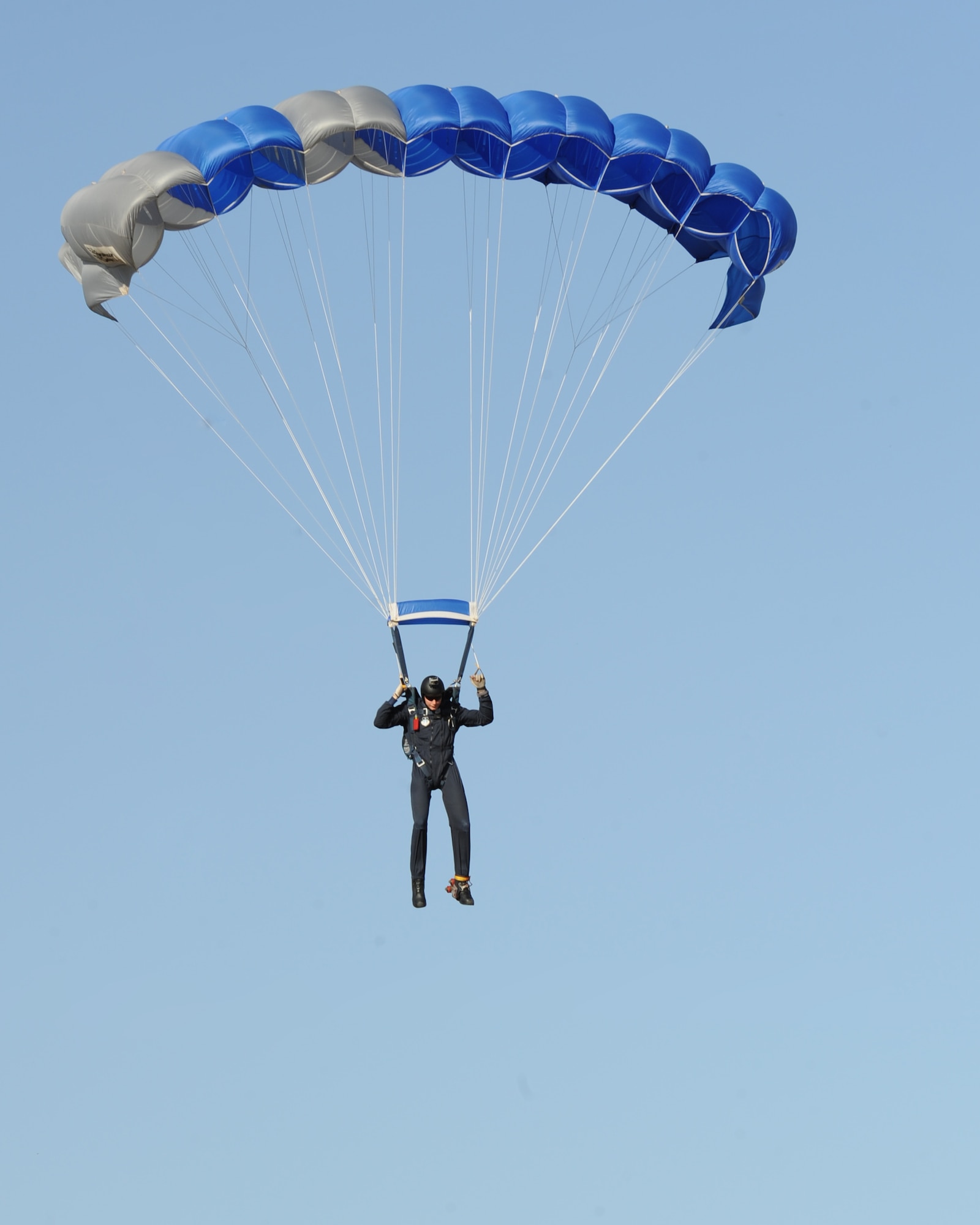 U.S. Air Force Tech. Sgt. Carl Howell, Air Force Academy Wings of Blue parachute team member, descends toward Dyess during the Rockin’ in the Park festival April 27, 2012, at Dyess Air Force Base, Texas. The festival offered free food and live entertainment to all military members, base civilian employees and family members. (U.S. Air Force photo by Staff Sgt. Richard P. Ebensberger/ Released)