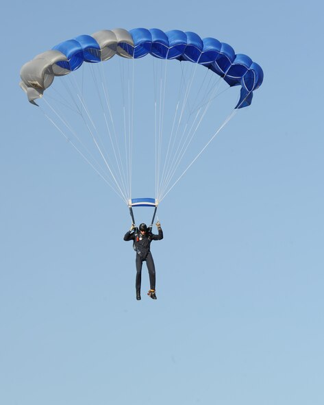 U.S. Air Force Tech. Sgt. Carl Howell, Air Force Academy Wings of Blue parachute team member, descends toward Dyess during the Rockin’ in the Park festival April 27, 2012, at Dyess Air Force Base, Texas. The festival offered free food and live entertainment to all military members, base civilian employees and family members. (U.S. Air Force photo by Staff Sgt. Richard P. Ebensberger/ Released)
