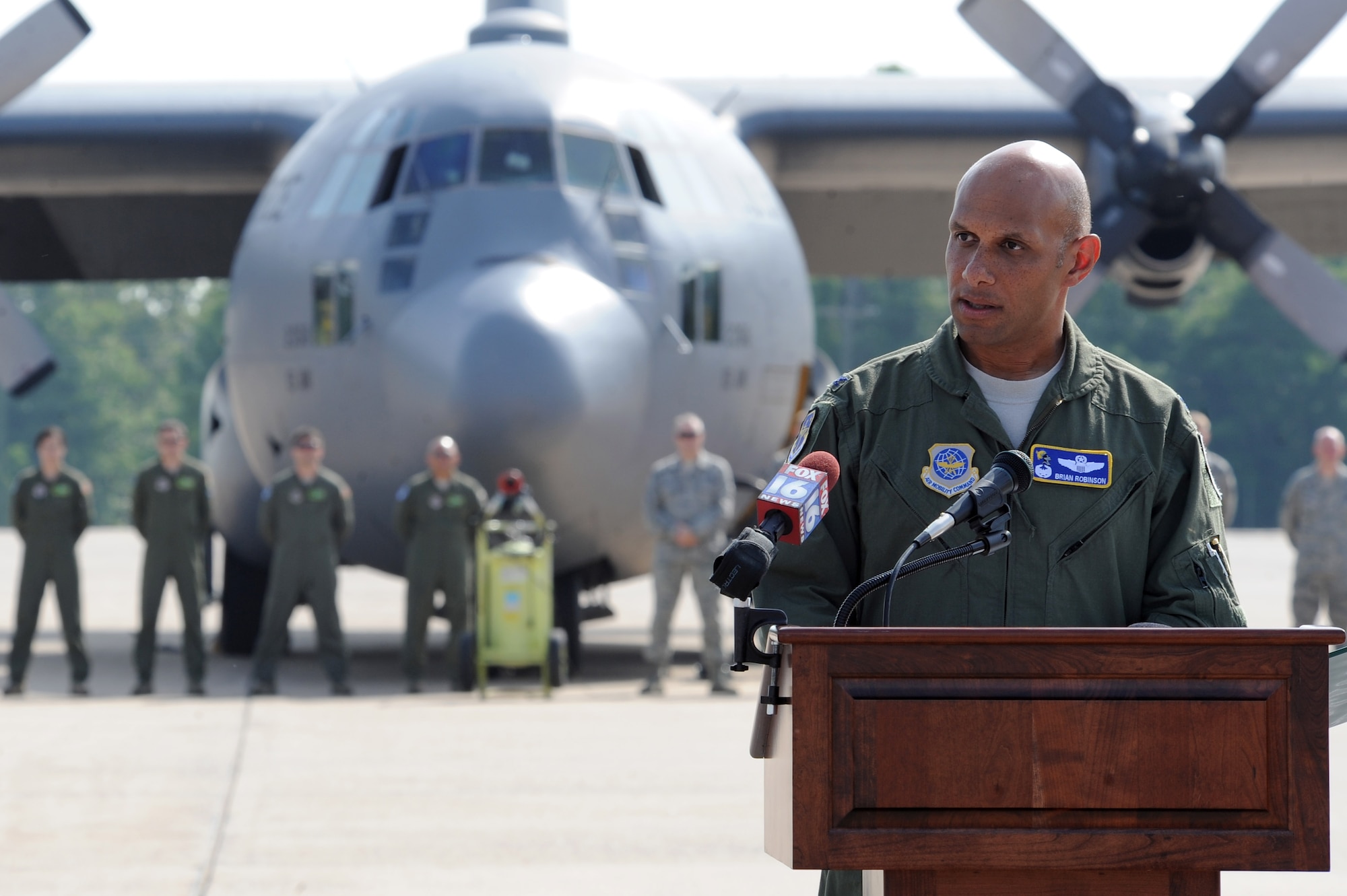 Col. Brian Robinson, 19th Airlift Wing commander, speaks to an audience attending the retirement of C130E 61-2358, May 1, 2012, at Little Rock Air Force Base, Ark. (U.S. Air Force photo by Tech. Sgt. Chad Chidholm)