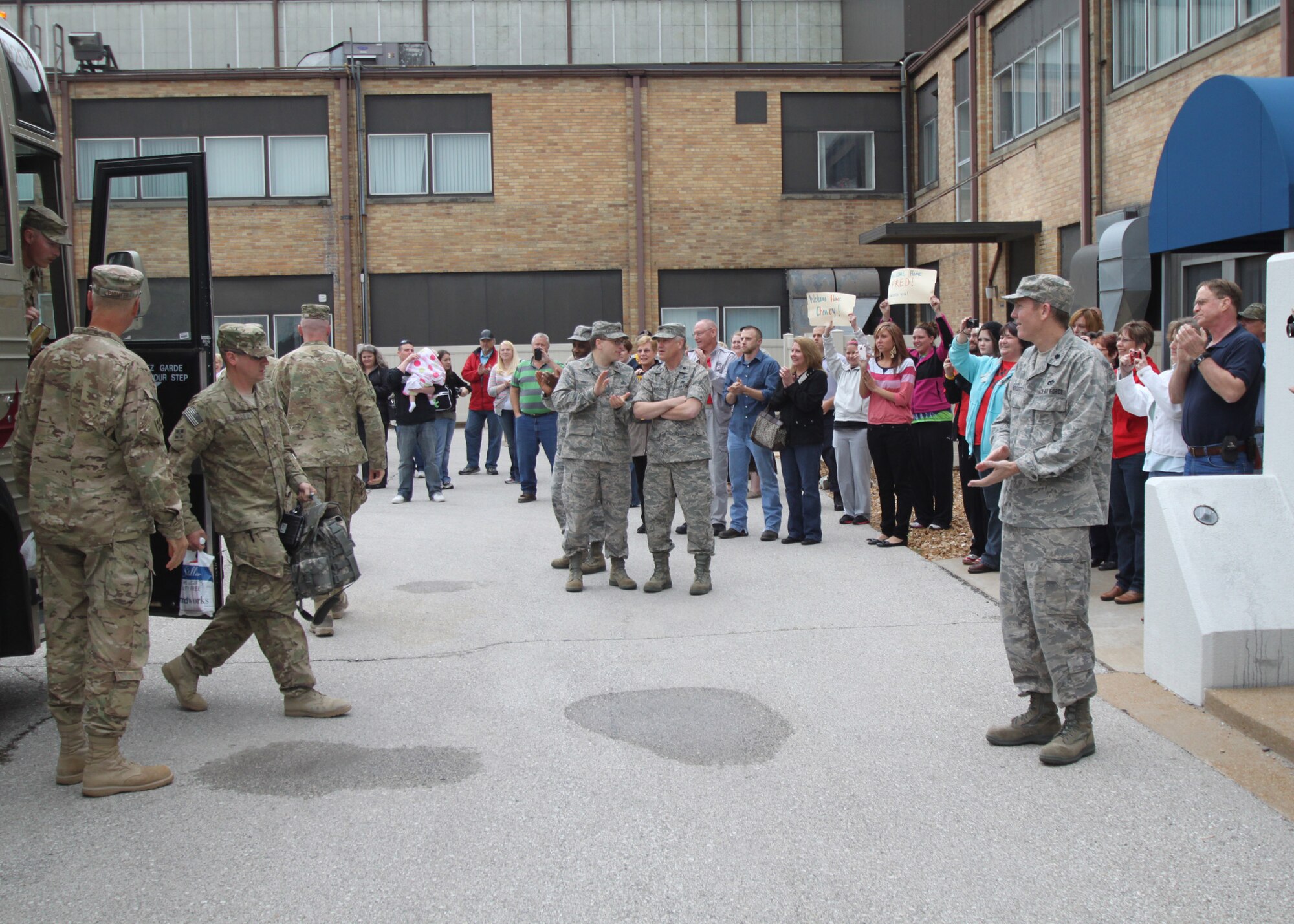 131st Bomb Wing members of Agricultural Development Team-Five return to the welcome of family and friends, April 20, at Lambert Air National Guard Base-Saint Louis.  An official welcome ceremony was held at the Ike Skelton Training Site, Missouri National Guard Headquarters, April 25.  (Photo by Chief Master Sgt. John Youngstrom).