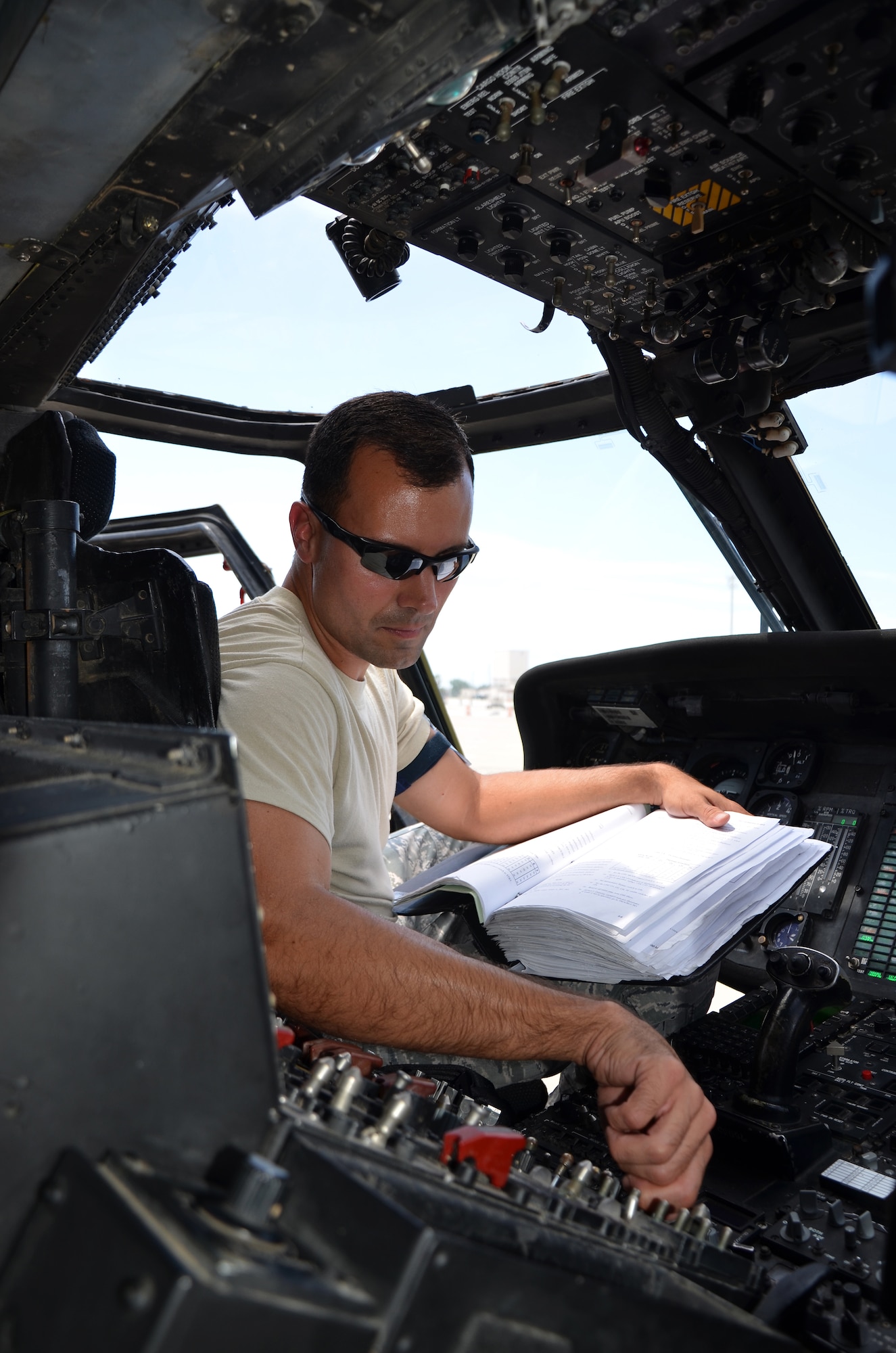 Staff Sgt. Ricardo Miguez, 920th Rescue Wing HH-60G Pave Hawk helicopter maintenance reservist, performs an operations check on a helicopter pre-flight. The reservists here have a rigorous training schedule that includes flying day and night to simulate any environment they may have to, one day, perform a life saving mission. Maintaining the aging fleet of aircraft is a full time job for maintenance reservists. The 920th RQW also has Pave Hawk helicopters and reserve maintenance crews at its geographically separated unit, Davis-Monthan Air Force Base, Ariz., and a rescue squadron at Portland International Airport, Ore.  (U.S. Air Force photo/2nd Lt. Leslie Forshaw)