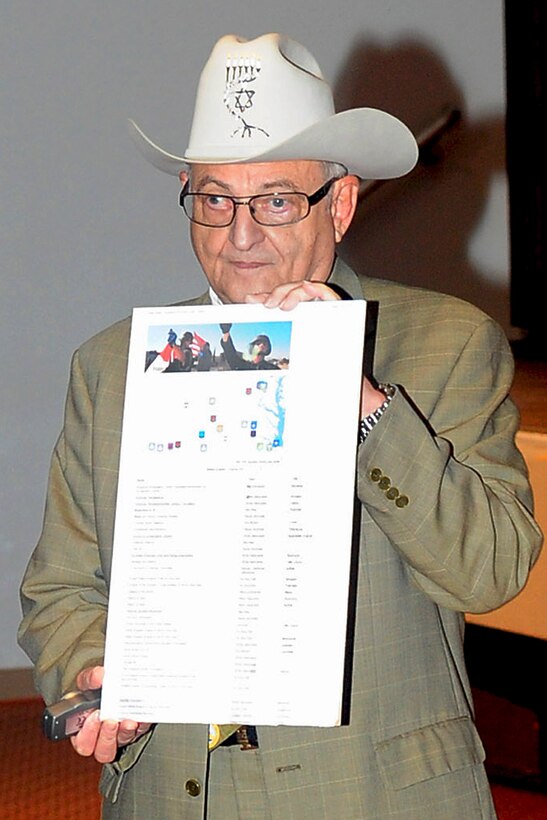 Jay Ipson, Virginia Holocaust Museum president and Holocaust survivor, presents a poster showing the various hate groups in the U.S., during the Days of Remembrance Ceremony at Fort Eustis, April 24, 2012. Ipson was a guest speaker at the ceremony, reminding everyone to remember that past, to prevent horrors of the future. (U.S. Air Force photo by Staff Sgt. Ashley Hawkins/Released)