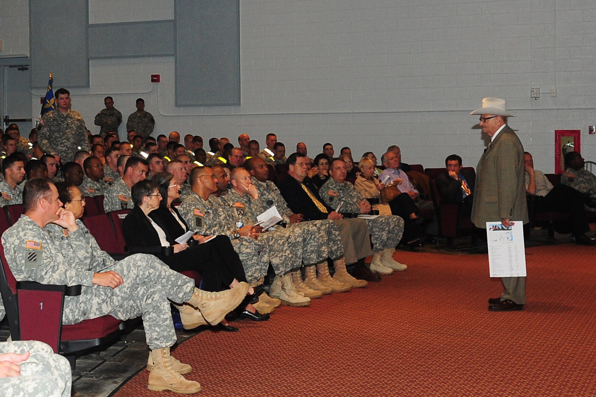 Jay Ipson, Virginia Holocaust Museum president, addresses the crowd during the Days of Remembrance Ceremony at Fort Eustis, April 24, 2012. A Holocaust survivor himself, Ipson presented his personal testimony of the inhumane events he witnessed, from the beginning when he was 7, to the very end, showing photos of his adult son standing in the hole his family hid in. (U.S. Air Force photo by Staff Sgt. Ashley Hawkins/Released)