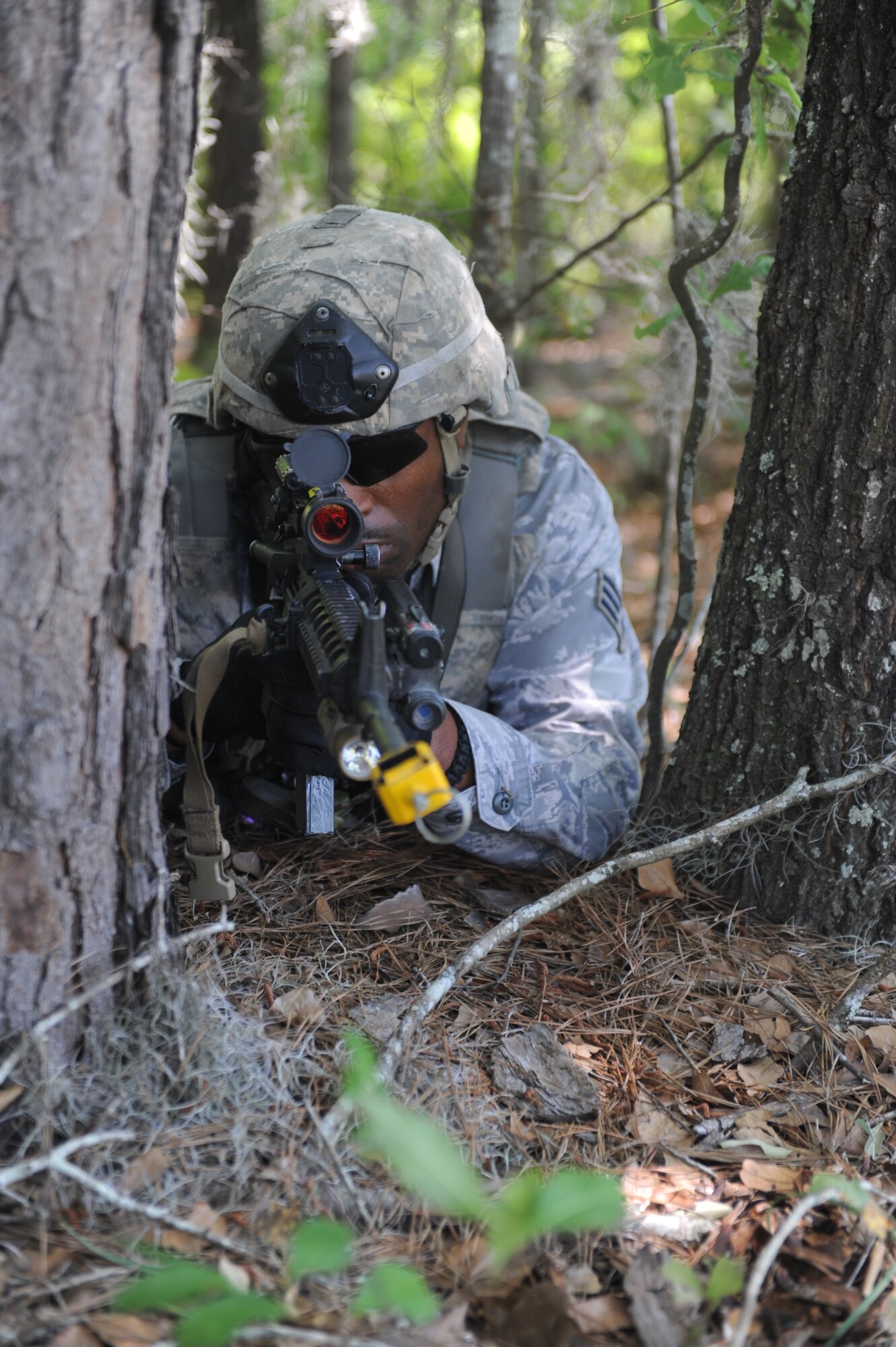 U.S. Air Force Senior Airman Damian Anderson, 820th Base Defense Group, takes aim while participating in an 820th operational readiness exercise at Moody Air Force Base, Ga., April 27, 2012. Anderson scanned his surroundings to ensure there were no hostile forces moving toward his position. (U.S. Air Force photo by Airman 1st Class Douglas Ellis/Released)
