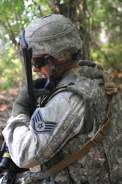 U.S. Air Force Staff Sgt. Richard Toy, 820th Base Defense Group, uses a radio during an 820th operational readiness exercise at Moody Air Force Base, Ga., April 27, 2012. Toy used the radio to communicate with other 820th BDG members to strategically advance their position. (U.S. Air Force photo by Airman 1st Class Douglas Ellis/Released)
