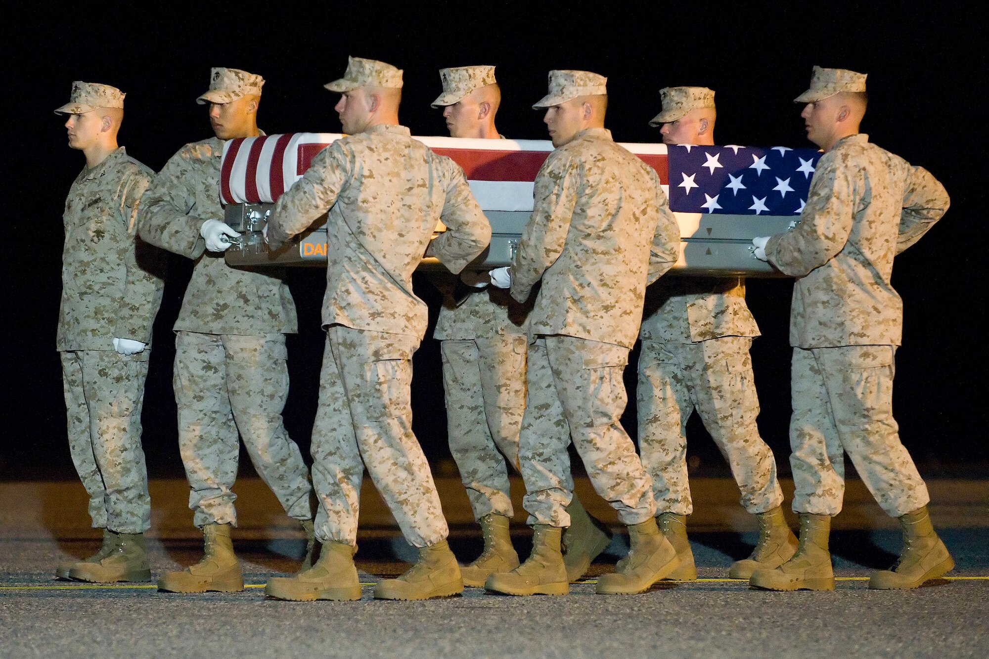 A U.S. Marine Corps carry team transfers the remains of Master Sgt. Scott E. Pruitt of Gautier, Miss., at Dover Air Force Base, Del., April 30, 2012. Pruitt was assigned to I Marine Expeditionary Force Headquarters Group, I Marine Expeditionary Force, Camp Pendleton, Calif. (U.S. Air Force photo/Adrian R. Rowan)
