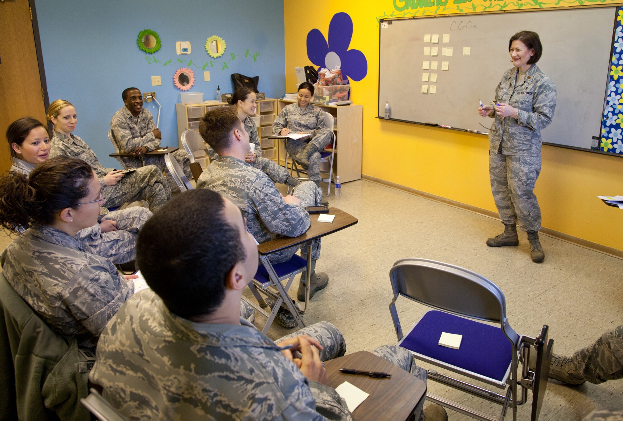 Maj. Melissa Gould, 60th Medical Operations Squadron suicide prevention officer, Resiliency Element chief and Travis Integrated Delivery System chair facilitates a discussion about quality of life issues among company grade officers during the Caring for People Forum at the Twin Peaks Chapel, April 18, 2012. (U.S. Air Force Photo / Lt. Col. Robert Couse-Baker)