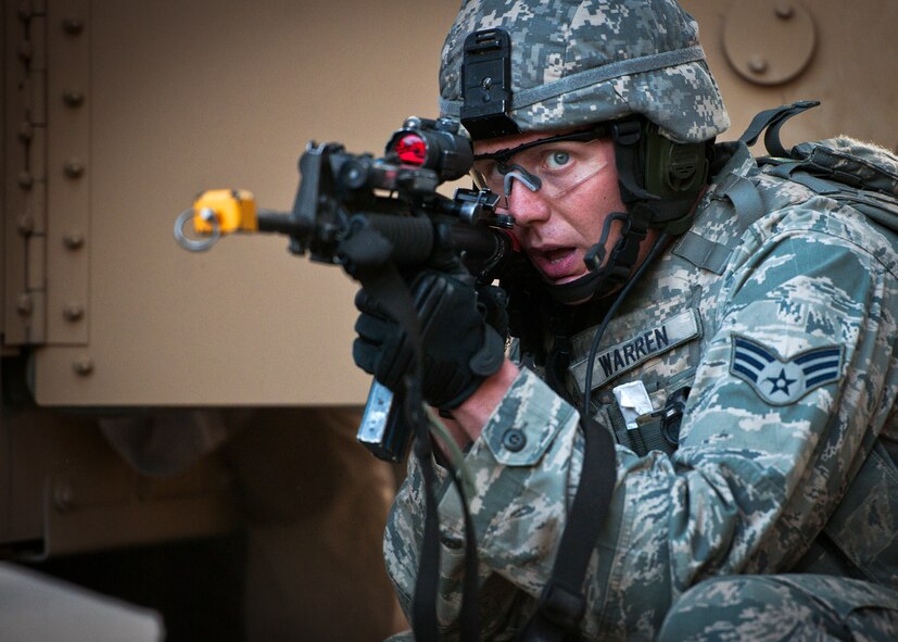 Senior Airman Robert Warren, of the 22nd Security Forces Squadron, covers his squad during the final mission of the three-day Brave Defender field training exercise April 28 at Eglin Air Force Base, Fla.  The exercise is the culmination of Air Force Materiel Command’s six-week security forces deployment training, administered by the 96th Ground Combat Training Squadron. GCTS instructors teach 10 training classes a year, which consists of improvised explosive device detection and reaction, operating in an urban environment, mission planning, land navigation, casualty care and more. More than 100 active-duty and National Guard Airmen attended this training. (U.S. Air Force photo/Samuel King Jr.)