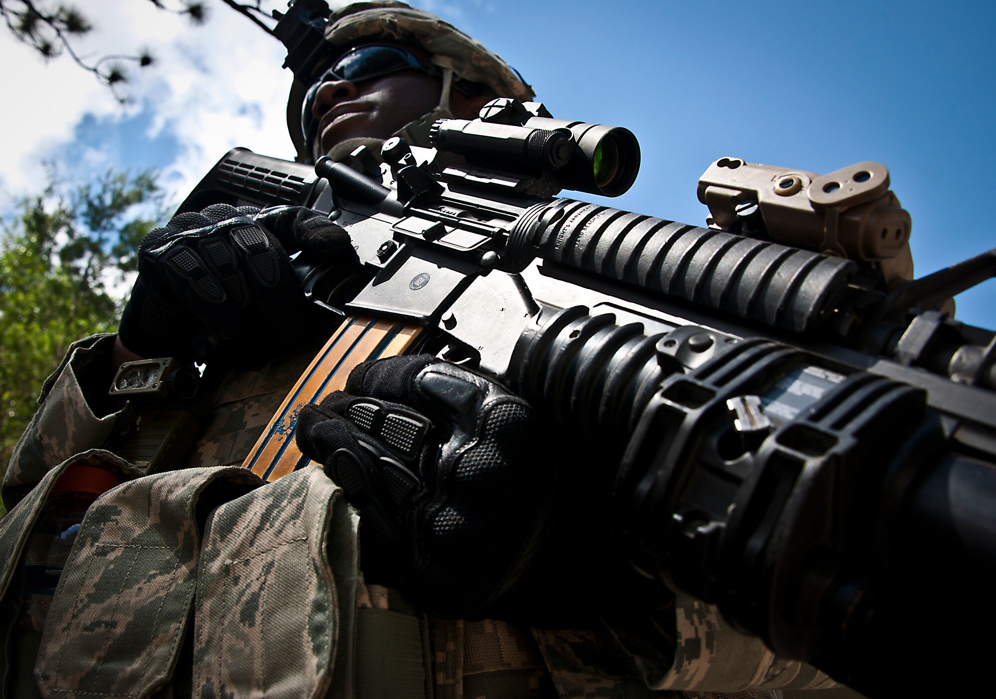 Airman 1st Class Dwayne Martin, of the 49th Security Forces Squadron, stands guard at the entry control point during the three-day Brave Defender field training exercise April 28 at Eglin Air Force Base, Fla.  The exercise is the culmination of Air Force Materiel Command’s six-week security forces deployment training, administered by the 96th Ground Combat Training Squadron. GCTS instructors teach 10 training classes a year, which consists of improvised explosive device detection and reaction, operating in an urban environment, mission planning, land navigation, casualty care and more. More than 100 active-duty and National Guard Airmen attended this training. (U.S. Air Force photo/Samuel King Jr.)