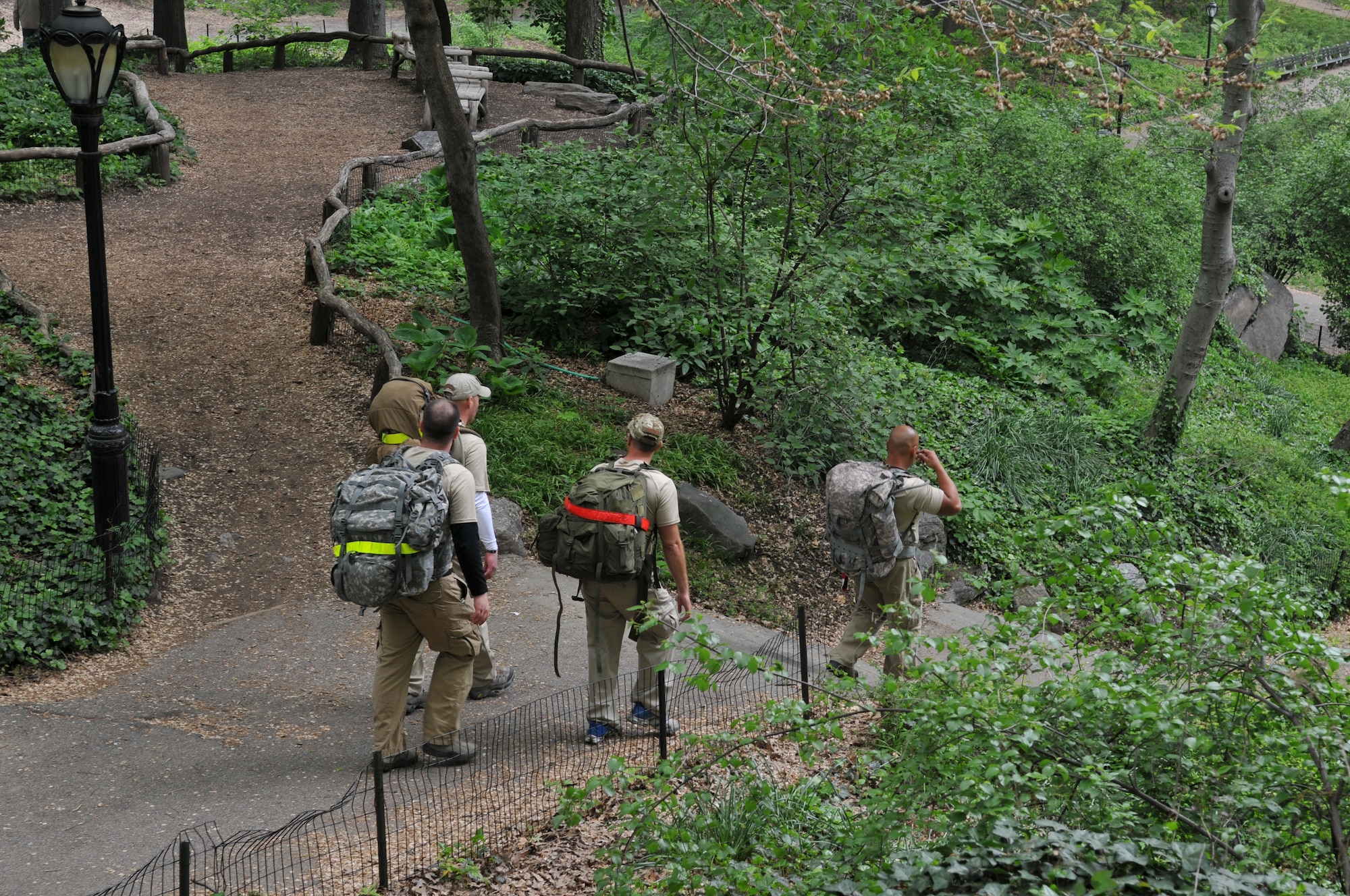 Several members of Team 1 make their way through Central Park in New York City during the Air Advisor Memorial Ruck March on April 26, 2012. The march, which took the Airmen approximately 90 miles from the World Trade Center to Joint Base McGuire-Dix-Lakhurst, N.J., was in remembrance of the nine air advisors who were killed April 27, 2011, in Kabul, Afghanistan. (U.S. Air Force photo/Tech. Sgt. Brian E. Christiansen)