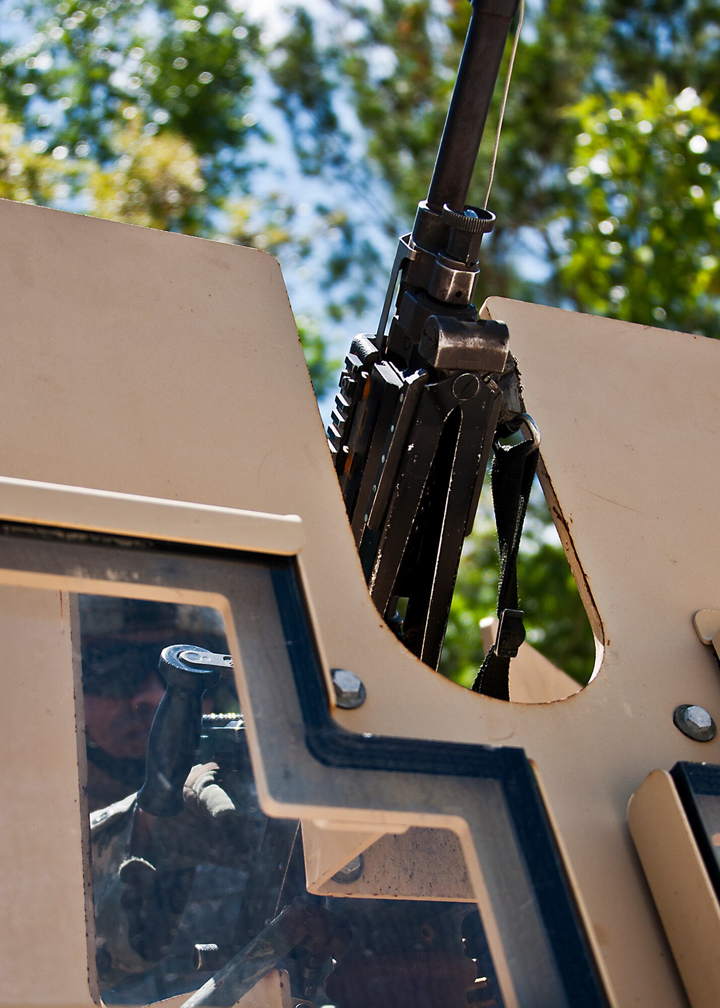 A Security Forces Airman checks his weapon in the turret of a Humvee prior to a vehicle patrol during the three-day Brave Defender field training exercise April 28 at Eglin Air Force Base, Fla.  The exercise is the culmination of Air Force Materiel Command’s six-week security forces deployment training, administered by the 96th Ground Combat Training Squadron. GCTS instructors teach 10 training classes a year, which consists of improvised explosive device detection and reaction, operating in an urban environment, mission planning, land navigation, casualty care and more. More than 100 active-duty and National Guard Airmen attended this training. (U.S. Air Force photo/Samuel King Jr.)