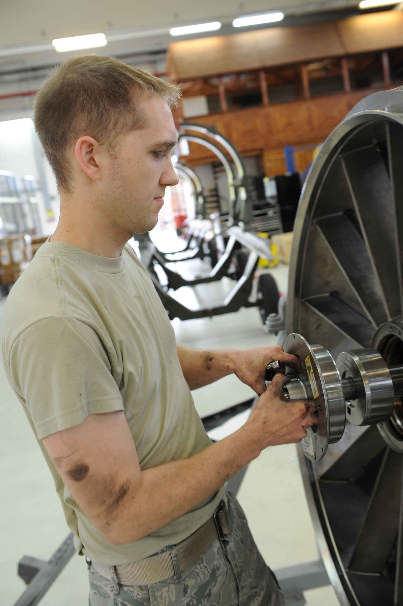 SPANGDAHLEM AIR BASE, Germany – Senior Airman Braden Duke, 52nd Component Maintenance Squadron aerospace propulsion technician, takes apart the front frame of an F-16 Fighting Falcon turbine during the removal of all the moving parts of the engine at Bldg. 73 here April 30. Technicians replace all these parts of the engine at Bldg. 73 here April 30. Technicians replace these moving parts in a turbine every 4,000 flight hours as required by the service life extension program. CMS provides maintenance support to the 52nd Fighter Wing, the 31st FW at Aviano AB, Italy, and all U.S. F-16 units powered by F-110 engines in the European theater and deployed locations. (U.S. Air Force photo by Senior Airman Christopher Toon/Released)