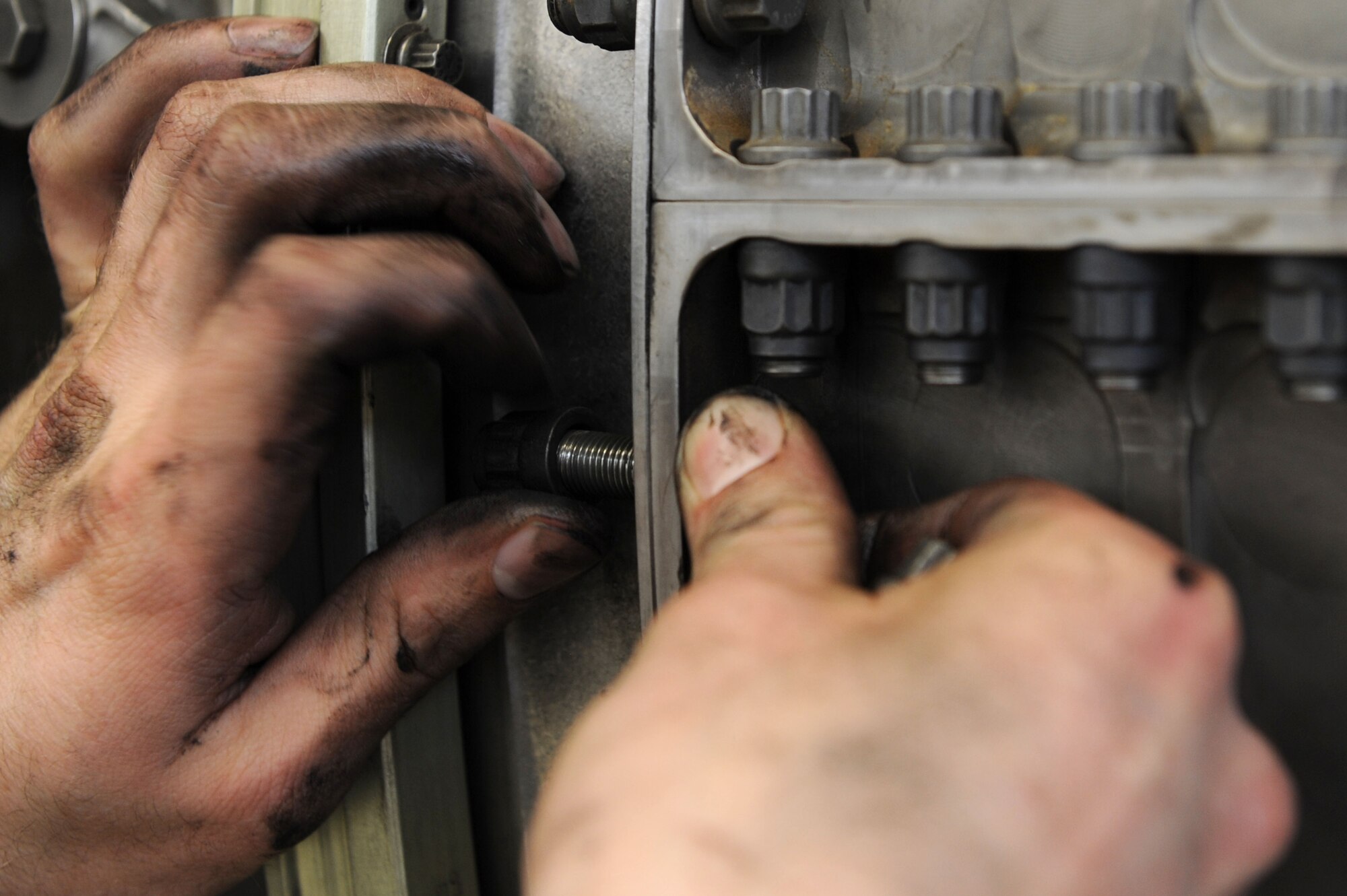 SPANGDAHLEM AIR BASE, Germany – Senior Airman Willis Jenson, 52nd Component Maintenance Squadron aerospace propulsion technician, removes bolts from an F-16 Fighting Falcon turbine frame to remove all moving parts of the engine at Bldg. 73 here April 30. Technicians replace these moving parts in a turbine every 4,000 flight hours as required by the service life extension program. CMS provides maintenance support to the 52nd Fighter Wing, the 31st FW at Aviano AB, Italy, and all U.S. F-16 units powered by F-110 engines in the European theater and deployed locations. (U.S. Air Force photo by Senior Airman Christopher Toon/Released)