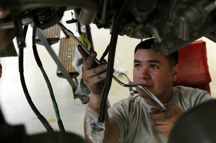 SPANGDAHLEM AIR BASE, Germany – Senior Airman Juan Serrano, 52nd Component Maintenance Squadron aerospace propulsion technician, removes bolts from an F-16 Fighting Falcon turbine frame to remove all moving parts of the engine at Bldg. 73 here April 30. Technicians replace these moving parts in a turbine every 4,000 flight hours as required by the service life extension program. CMS provides maintenance support to the 52nd Fighter Wing, the 31st FW at Aviano AB, Italy, and all U.S. F-16 units powered by F-110 engines in the European theater and deployed locations. (U.S. Air Force photo by Senior Airman Christopher Toon/Released)