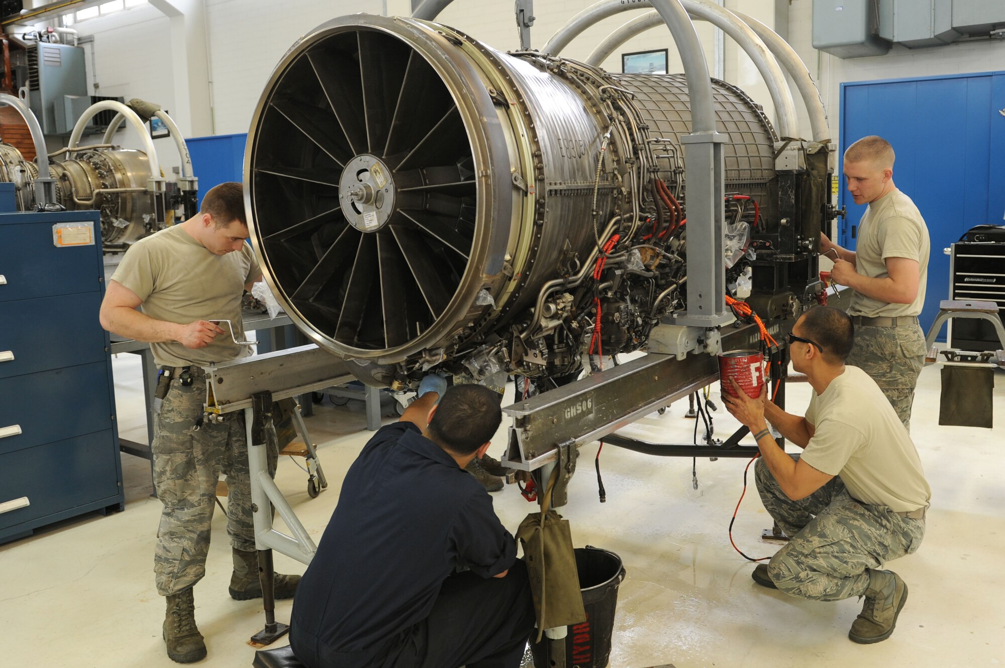 SPANGDAHLEM AIR BASE, Germany – Aerospace propulsion technicians from the 52nd Component Maintenance Squadron prepare an F-16 Fighting Falcon turbine to remove all moving parts of the engine at Bldg. 73 here April 30. Technicians replace these moving parts in a turbine every 4,000 flight hours as required by the service life extension program. CMS provides maintenance support to the 52nd Fighter Wing, the 31st FW at Aviano AB, Italy, and all U.S. F-16 units powered by F-110 engines in the European theater and deployed locations. (U.S. Air Force photo by Senior Airman Christopher Toon/Released)