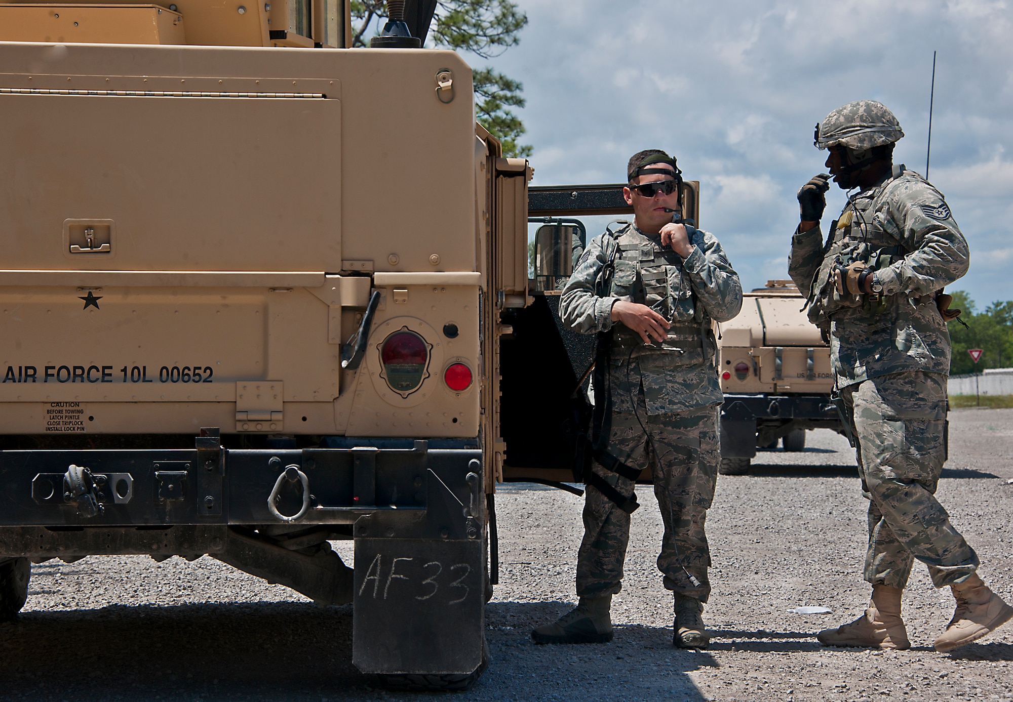 Security Forces Airmen check their communication systems prior to a vehicle patrol during the three-day Brave Defender field training exercise April 28 at Eglin Air Force Base, Fla.  The exercise is the culmination of Air Force Materiel Command’s six-week security forces deployment training, administered by the 96th Ground Combat Training Squadron. GCTS instructors teach 10 training classes a year, which consists of improvised explosive device detection and reaction, operating in an urban environment, mission planning, land navigation, casualty care and more. More than 100 active-duty and National Guard Airmen attended this training. (U.S. Air Force photo/Samuel King Jr.)