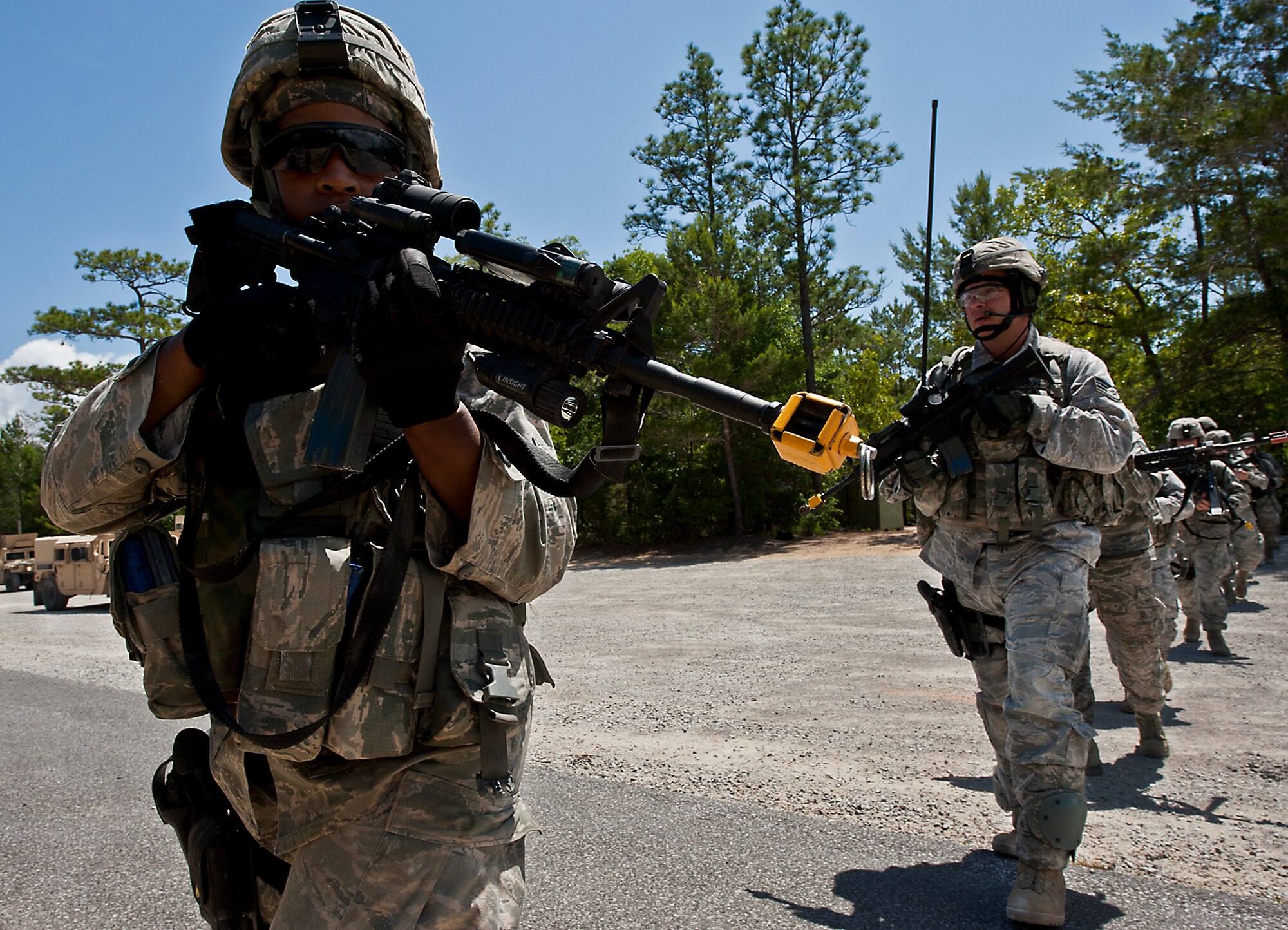 Security Forces Airmen practice ‘danger crossing’ procedures during the three-day Brave Defender field training exercise April 28 at Eglin Air Force Base, Fla.  The exercise is the culmination of Air Force Materiel Command’s six-week security forces deployment training, administered by the 96th Ground Combat Training Squadron. GCTS instructors teach 10 training classes a year, which consists of improvised explosive device detection and reaction, operating in an urban environment, mission planning, land navigation, casualty care and more. More than 100 active-duty and National Guard Airmen attended this training. (U.S. Air Force photo/Samuel King Jr.)