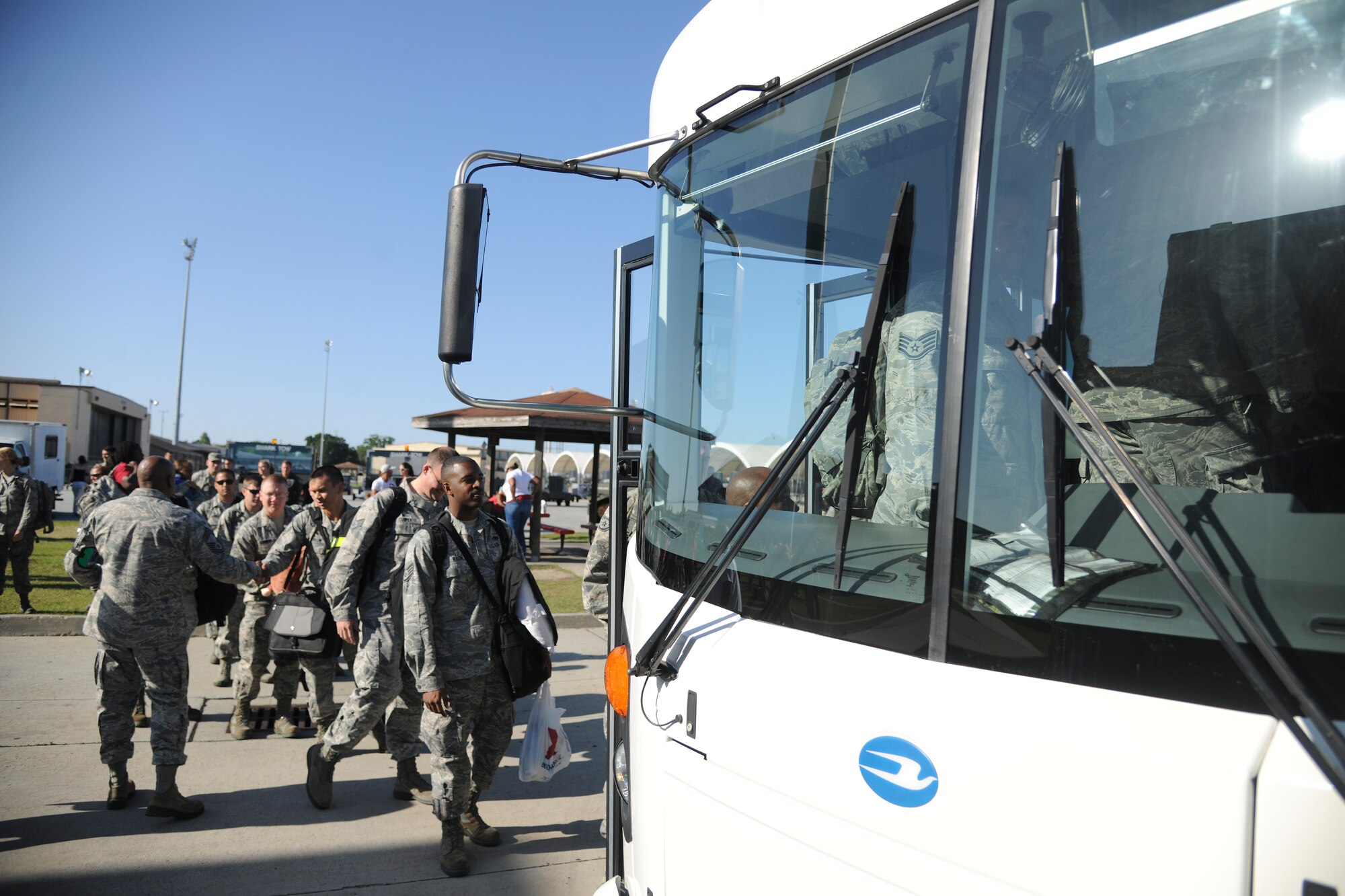 U.S. Air Force Airmen board a bus headed to the deployment control center at Moody Air Force Base Ga., before departing for Osan Air Base, Republic of Korea, April 22, 2012. The team of Airmen are deploying as an air expeditionary force for approximately 6 months. (U.S. Air Force Photo by Airman 1st Class Paul Francis/Released)
