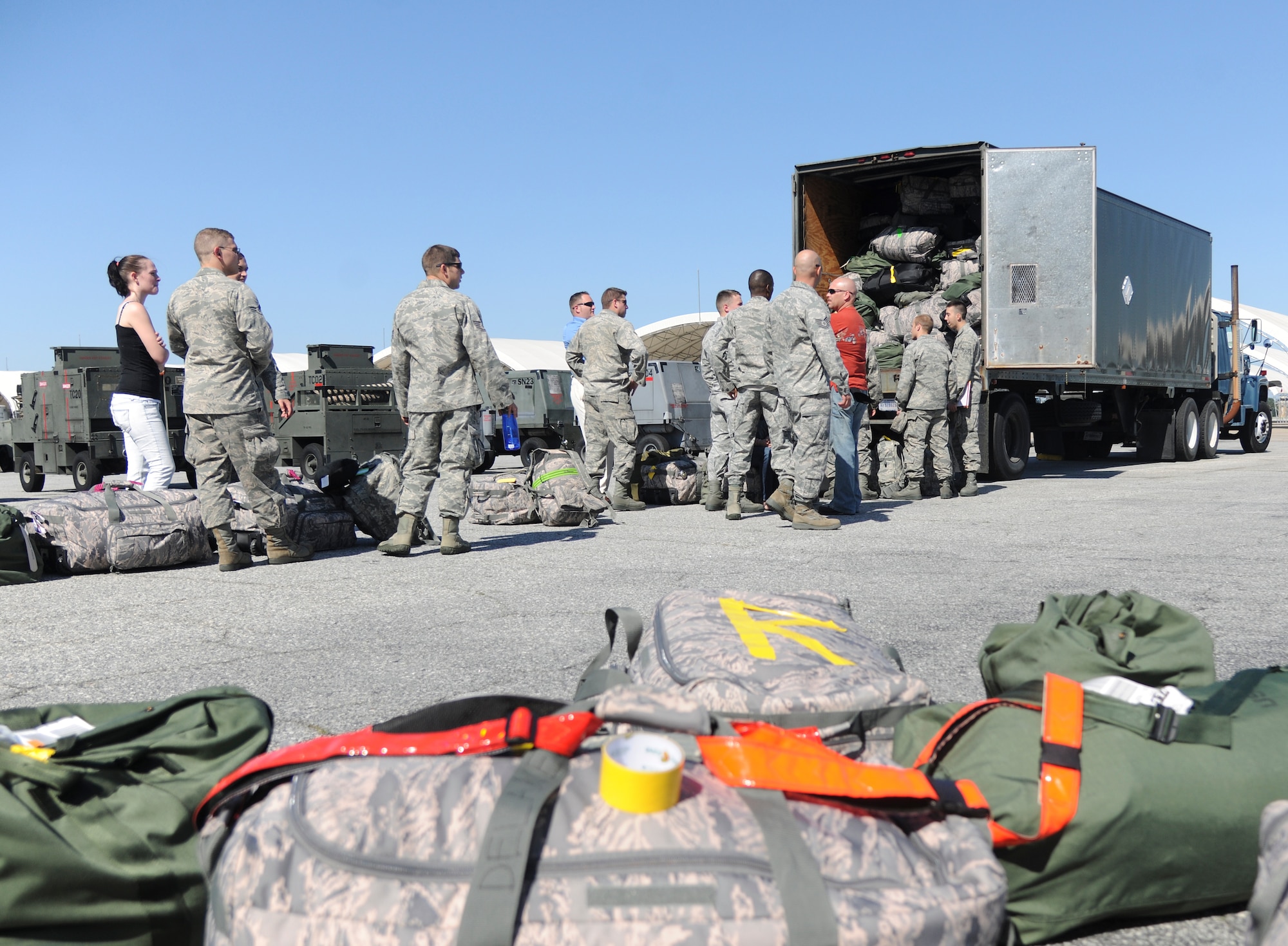 U.S. Air Force Airmen load their gear as they prepare to deploy to Osan Air Base, Republic of Korea from Moody Air Force Base Ga., April 22, 2012. Approximately 250 pilots, maintenance and other personnel will support A-10C Thunderbolt IIs while deployed. (U.S. Air Force Photo by Airman 1st Class Paul Francis/Released)
