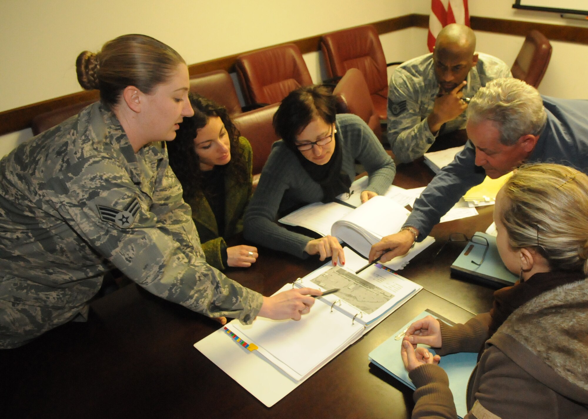 Senior Airman Anna Marie Al Dabbagh, 31st Contracting Squadron contracting specialist, reviews a proposal for a potential base construction project April 11 at Aviano Air Base, Italy. Al Dabbagh was recently chosen as one of the 12 U.S. Air Forces in Europe Outstanding Airman of the Year for 2011. This prestigious award recognizes enlisted personnel for superior leadership, job performance, community involvement, and personal achievements. (U.S. Air Force photo/Airman 1st Class Briana Jones)