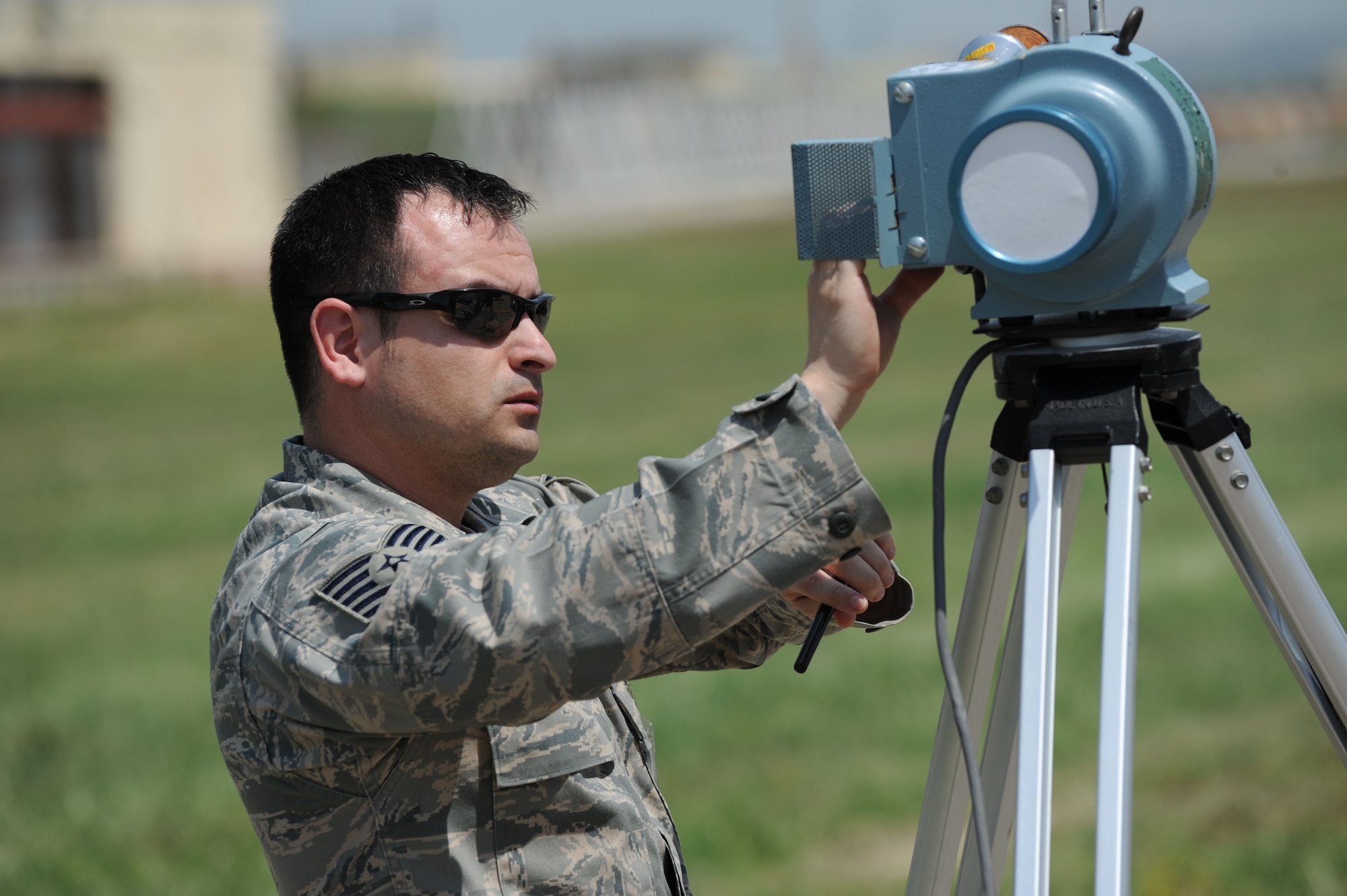 Tech. Sgt. Jacob Romero, 39th Medical Operations Squadron bioenvironmental engineering craftsman, sets up an air sampler to determine what personal protective equipment first responders should don during a field training exercise April 27, 2012, at Incirlik Air Base, Turkey. The exercise tested emergency management's ability to respond effectively to an incident. (U.S. Air Force photo by Senior Airman Jarvie Z. Wallace/Released)