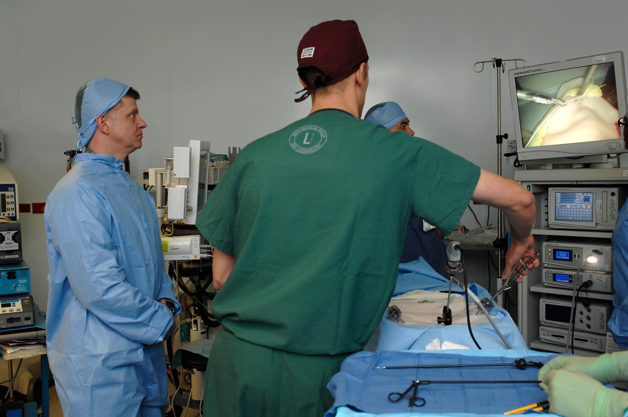 ROYAL AIR FORCE LAKENHEATH, England -- Capt. Adam Walker, 48th Medical Surgical Operations Squadron urologist, talks to Col. Kyle Robinson, 48th Fighter Wing commander, about general procedures inside the laparoscopic simulator April 25, 2012. The tour was part of an initiative by the 48th Medical Group to give the wing’s new commander insight into their operations. (U.S. Air Force photo by Tech. Sgt. Lee A. Osberry Jr.)