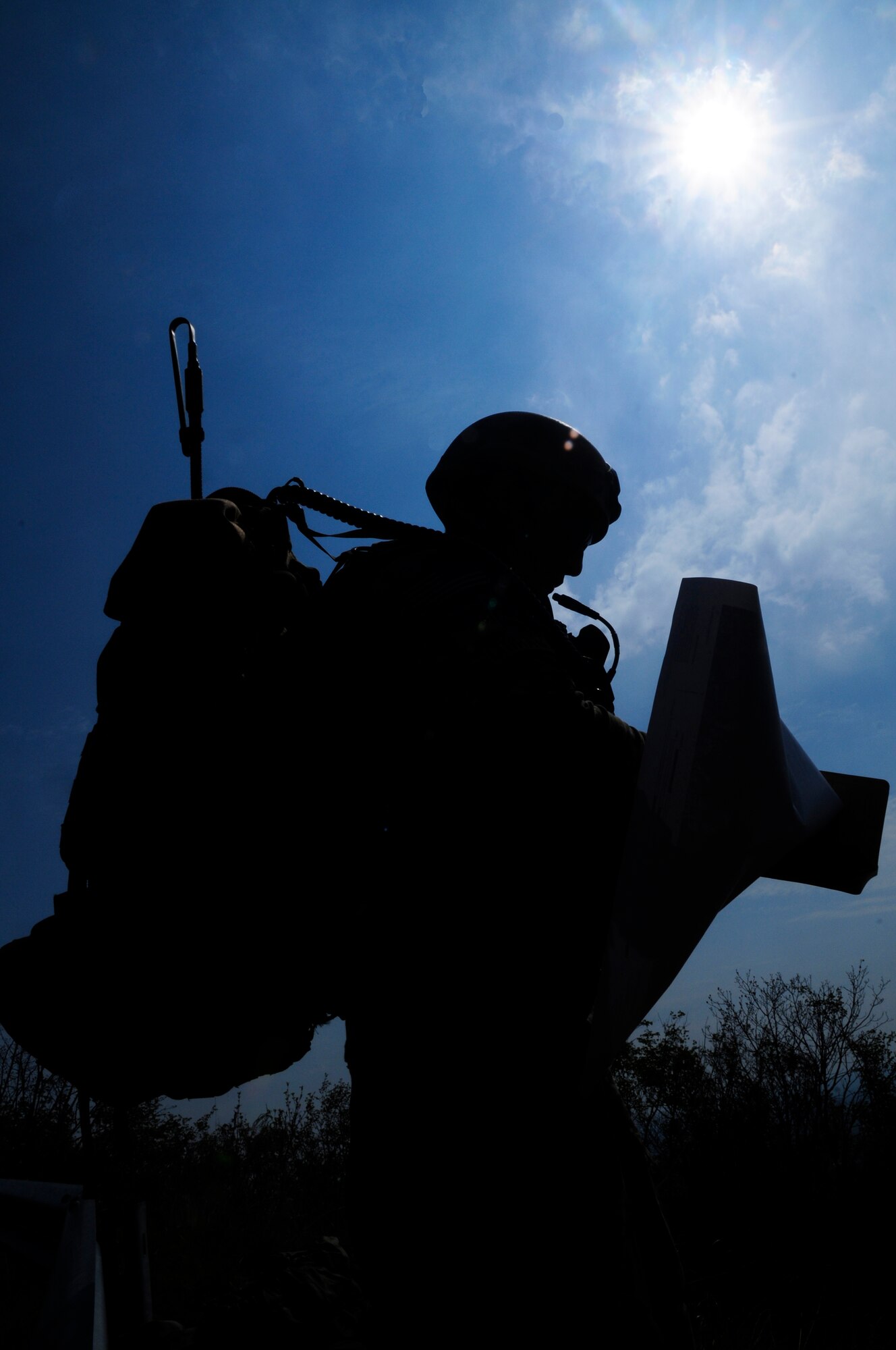 Airman 1st Class Andrew Beediahram, 8th Air Support Operations Squadron tactical air control party member, looks over a map during a training mission April 18 in northern Italy. TACP members conduct off base training three to four times a week to improve efficiency of close air support. (U.S. Air Force photo/Airman 1st Class Briana Jones)