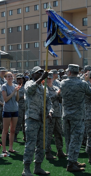 Chief Master Sgt. Timothy Ross, first sergeant, and Airmen of the 51st Logistics Readiness Squadron cheer April 30, 2012, after hearing their grade from the Pacific Air Forces Consolidated Unit Inspection.  Osan was the first PACAF base to undergo a CUI, which combined several inspections into one.  (U.S. Air Force photo / Senior Master Sgt. Stuart Camp)