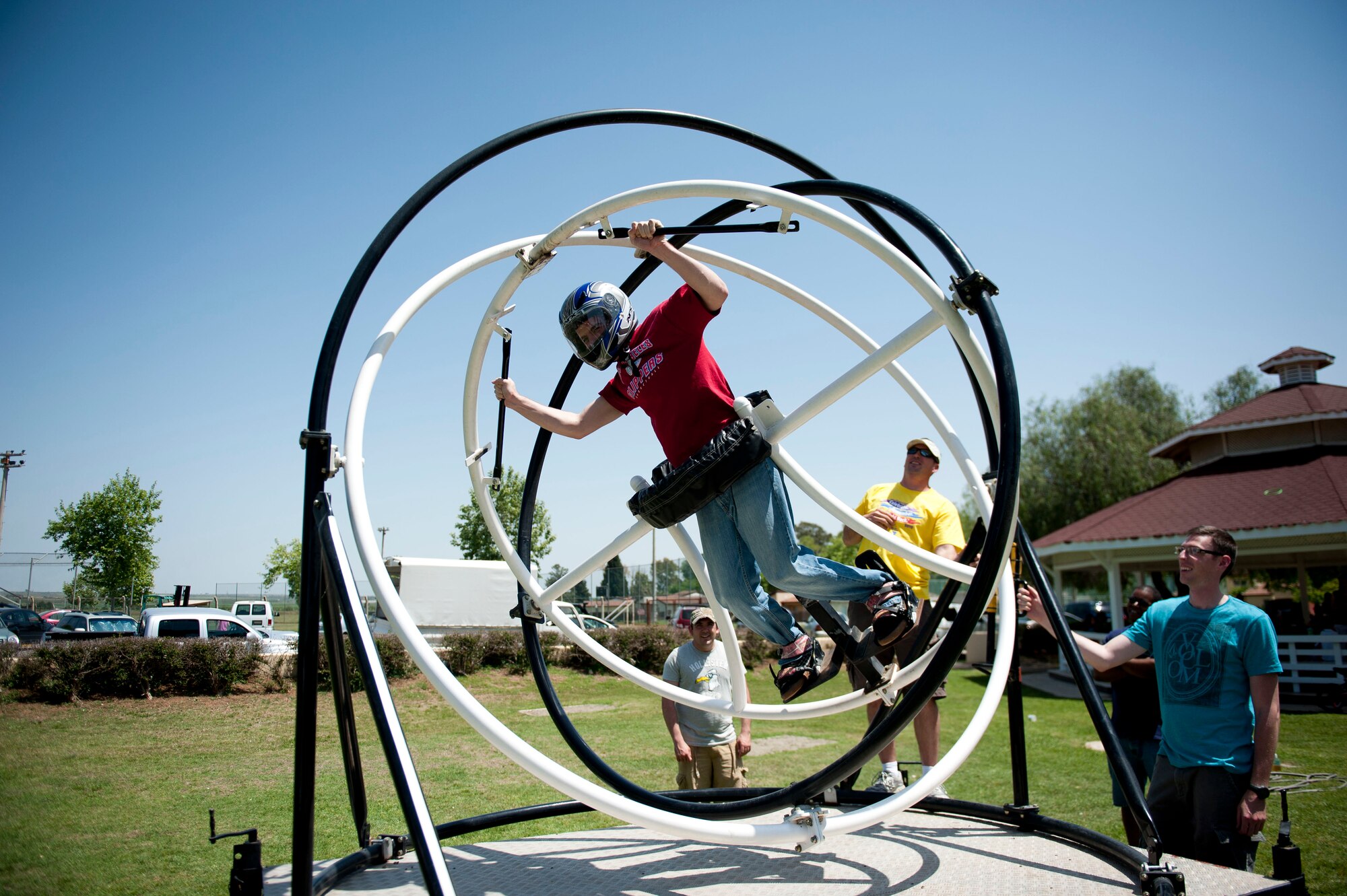 Senior Airman William O'Brien, 39th Air Base Wing public affairs, spins on the gyroscope run by the 39th Communications Squadron during the Spring Fling April 28, 2012, at Incirlik Air Base, Turkey. The event offered members of Team Incirlik a chance to enjoy warmer weather while taking part in various fair-style festivities. (U.S. Air Force photo by Senior Airman Clayton Lenhardt/Released)