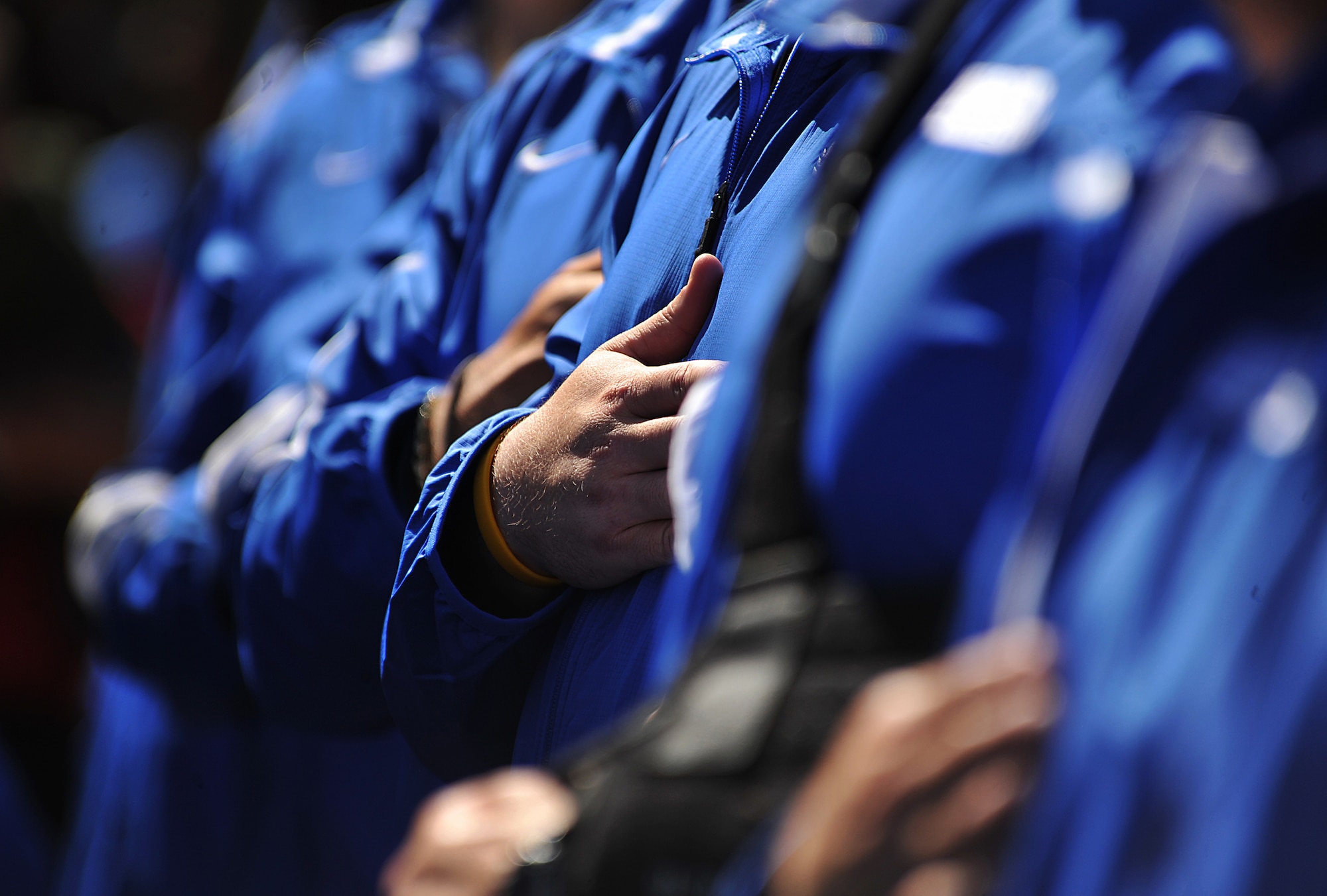 Members of the Air Force team honor the flag during the opening ceremony of Warrior Games 2012 at Colorado Springs, Colo., May 1, 2012. (U.S. Air Force photo by Val Gempis/Released)