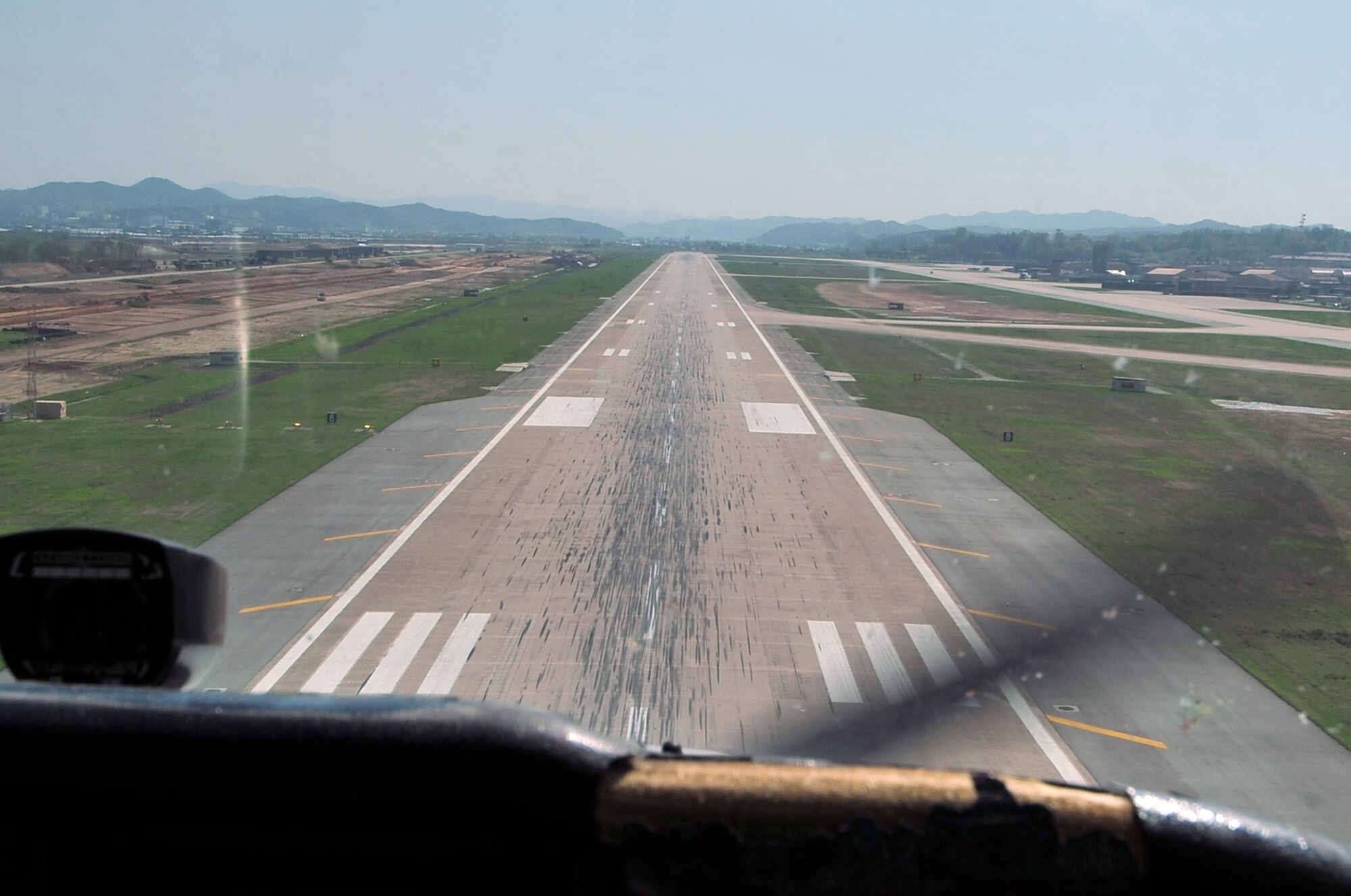 Senior Airman Joseph Cider, 51st Maintenance Squadron aircraft structural maintainer, descends to land a Cessna 172 onto the flight line at Osan Air Base, Republic of Korea, April 30, 2012. Cider earned his FAA license in 2010. (U.S. Air Force photo/Staff Sgt. Craig Cisek)