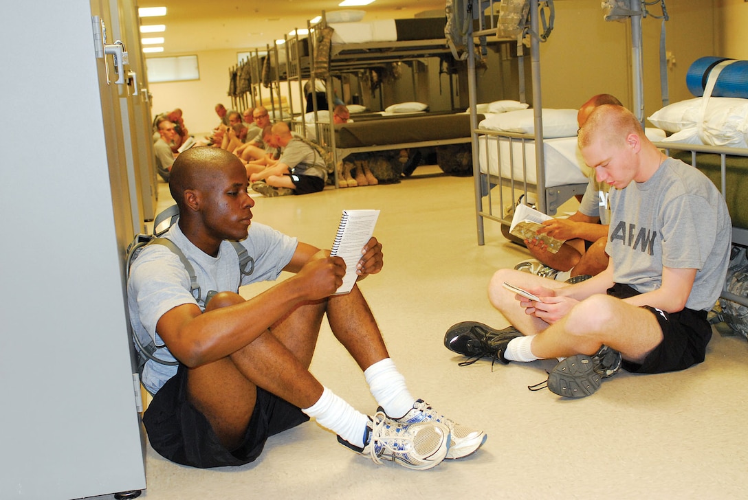 FORT BENNING, Ga. — Pvt. Demarcus Neloms (left), and other Soldiers from the Fitness Training Unit, 30th Adjutant General Battalion (Reception), study in the barracks, Apr. 20, 2012. The Reception Station Barracks on Sand Hill earned 35 of 69 credits within the Leadership in Energy and Environmental Design rating system to reach silver status -- 33 is the minimum for official certification.