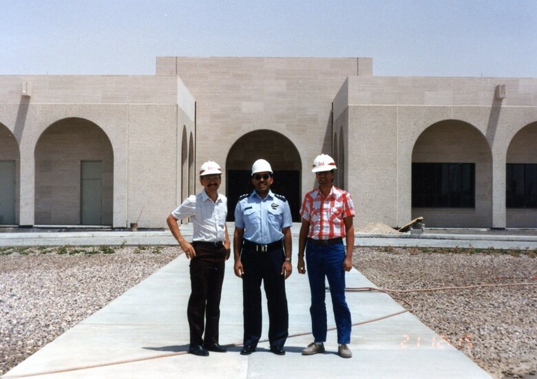 Santucci with Capt. Yousep and Mohamid Khan in front of 98-percent complete flight training center in Kuwait, fall 1989.