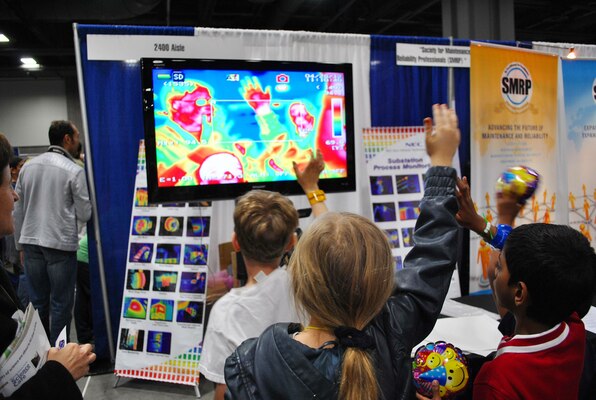WASHINGTON, D.C. — Children marvel over their images on a flat screen taken by an infrared camera at the 2012 USA Science and Engineering Expo here, April 29.