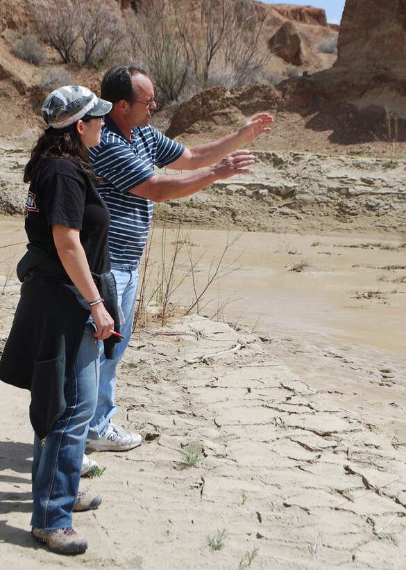 Project Manager Eddie Paulsgrove talks to Assistant Location Manager Jennifer Joyce about the intended film location. 
