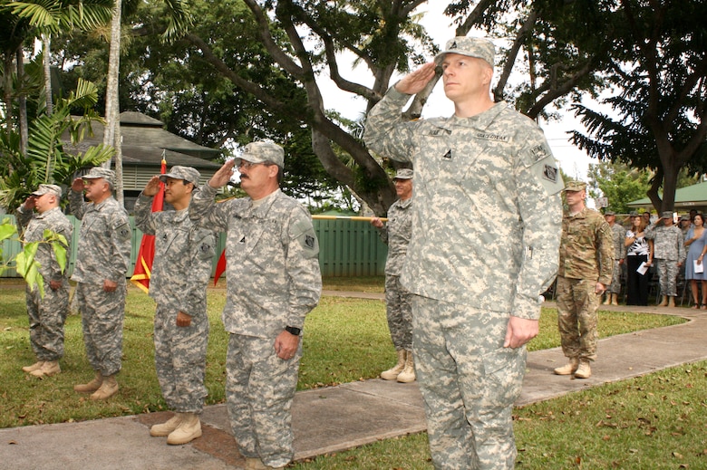 FEST-A members David Nishimura, left, Alan Avery, Jon Hosaka, Bill Hollingsworth, and Jason Blair salute the flag during the National Anthem during the Deployment Casing Ceremony held for the Honolulu District-based 565th Engineer Detachment, Forward Engineer Support Team-Advance (FEST-A)  April 24 at Fort Shafter’s Palm Circle to mark its official deployment to support Operation Enduring Freedom in Afghanistan. 