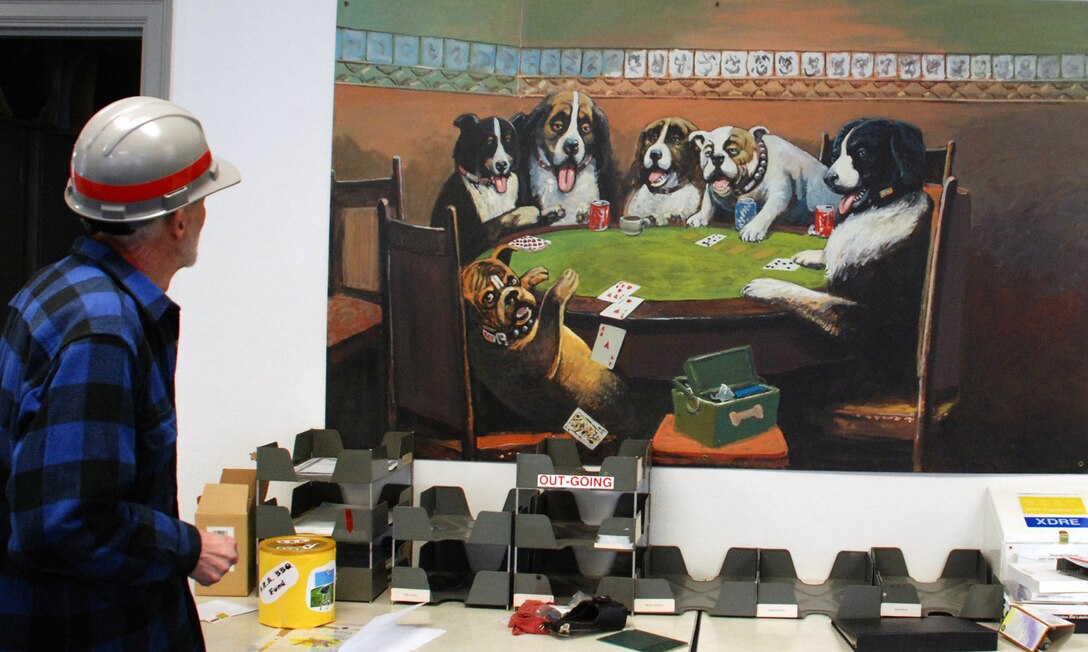 Lee regards his mural of dogs playing cards. Bonneville Lock and Dam is known for many things, like history and hydropower, but artwork? Lee Jensen, who worked there between 1991 and 2001, left his mark ... in a very creative way.