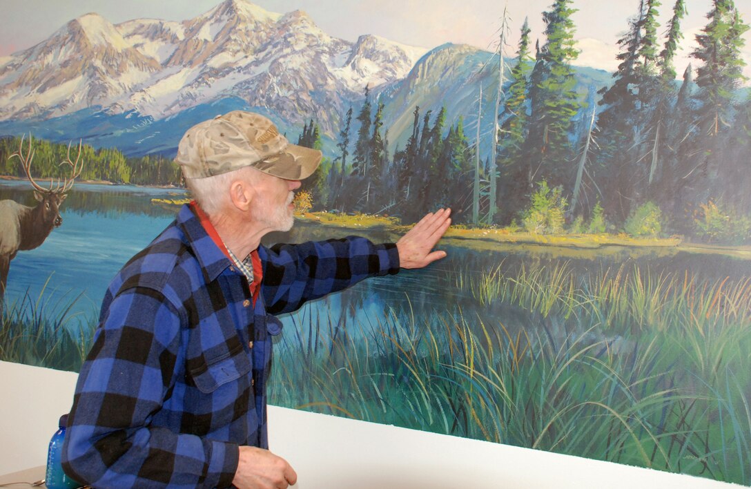 Lee Jensen regards a mural of he had painted years ago. Bonneville Lock and Dam is known for many things, like history and hydropower, but artwork? Lee Jensen, who worked there between 1991 and 2001, left his mark ... in a very creative way.