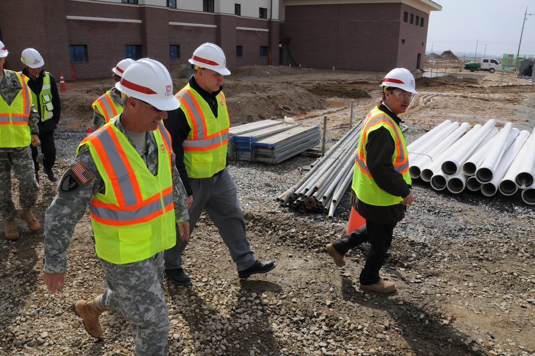 Brig. Gen. Richard Stevens, U.S. Army Corps of Engineers, Pacific Ocean Division Commander, walks through the Build-to-Lease Senior Leaders’ Quarters complex at U.S. Army Garrison Humphreys April 3.  