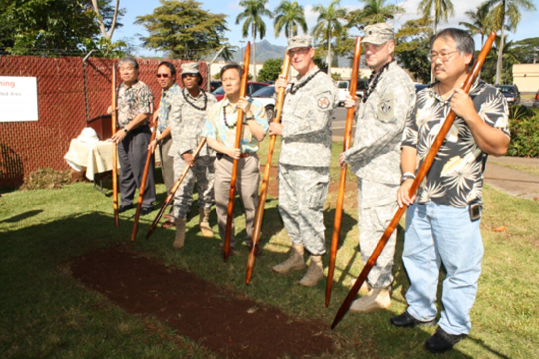 USAG-HI Executive Officer Col. Jay Hammer, (third from right) leads the turning of the soil ground breaking for the $59.05 million Warriors in Transition Barracks and complex on Monday April 2. Also participating are (left to right) Lloyd Arakaki, Architects Hawaii, Ltd; Dickson Ma, Schofield Barracks Area Engineer, U.S. Army Corps of Engineers -Honolulu District; Maj. Stephanie Garvin, deputy commander Warrior Transition Battalion, Schofield Barracks; Glen Kaneshige, president, Nordic PCL, Inc., Col. Hammer; Lt. Col. Douglas B. Guttormsen, commander, U.S. Army Corps of Engineers- Honolulu District; and Owen Ogata, Construction Project Engineer, U.S. Army Corps of Engineers-Honolulu District. 