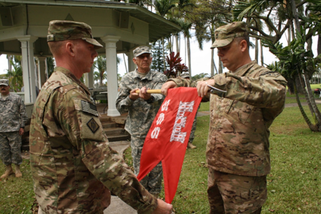 The Honolulu District-based 565th Engineer Detachment, Forward Engineer Support Team-Advance (FEST-A) held a Deployment Casing Ceremony April 24 at Fort Shafter’s Palm Circle to mark its official deployment to support Operation Enduring Freedom in Afghanistan. In this photo 565th ENG DET Commander Maj. William Hannan (center left), Mike Bruse and Sgt. 1st Class Gary Malkin case the detachment guidon. 