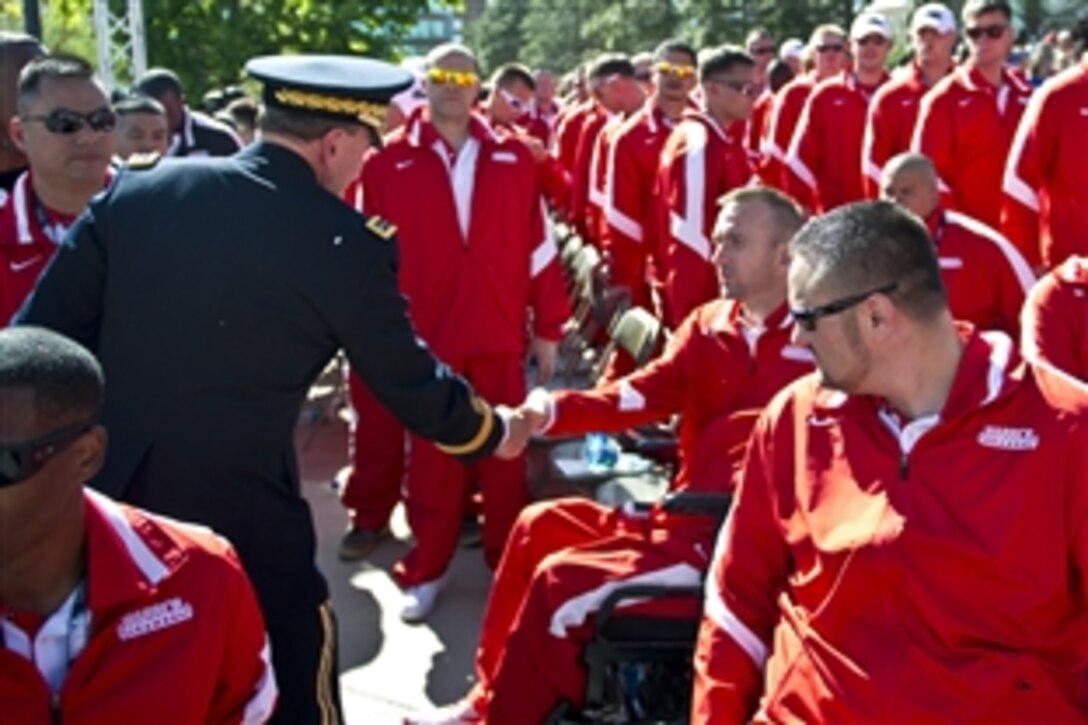 Army Gen. Martin E. Dempsey, chairman of the Joint Chiefs of Staff, greets participants at the opening ceremony for the 2012 Warrior Games in Colorado Springs, Colo., April 30, 2012.