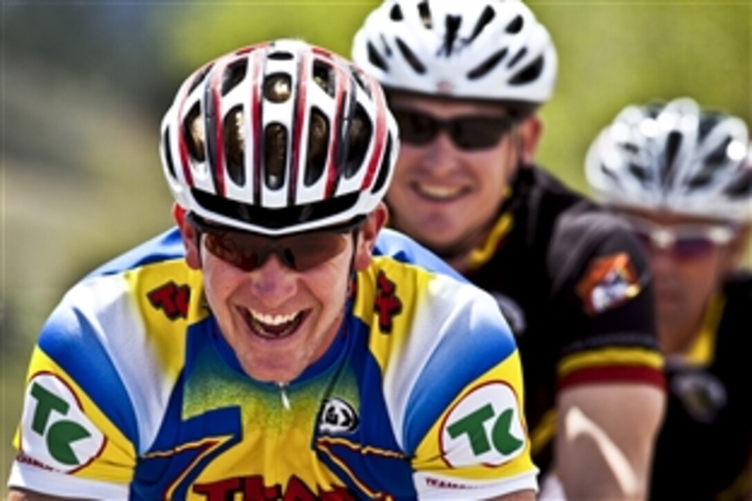 Marines laugh during cycling practice for the 2012 Warrior Games in Colorado Springs, Colo., April 23, 2012. The event, which runs from May 1 through May 5, offers competitions for wounded warriors in swimming, track and field, cycling, shooting, archery, sitting volleyball and wheelchair basketball.