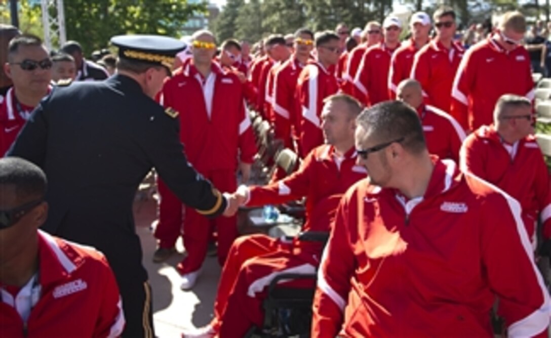 Chairman of the Joint Chiefs of Staff Gen. Martin E. Dempsey shakes hands with athletes and supporters of the 2012 Warrior Games in Colorado Springs, Colo., on April 30, 2012.  The Warrior Games is an annual event allowing wounded, ill and injured Service members and veterans to compete in Paralympics sports including archery, cycling, shooting, sitting volleyball, track and field, swimming and wheelchair basketball.  