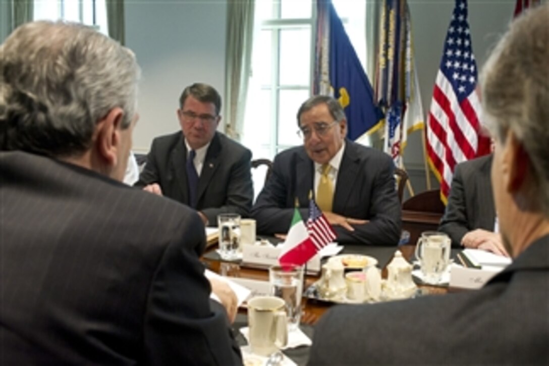 Secretary of Defense Leon E. Panetta (right) and Deputy Secretary of Defense Ashton Carter meet with Italian Minister of Defense Giampaolo Di Paola in the Pentagon on April 30, 2012. 