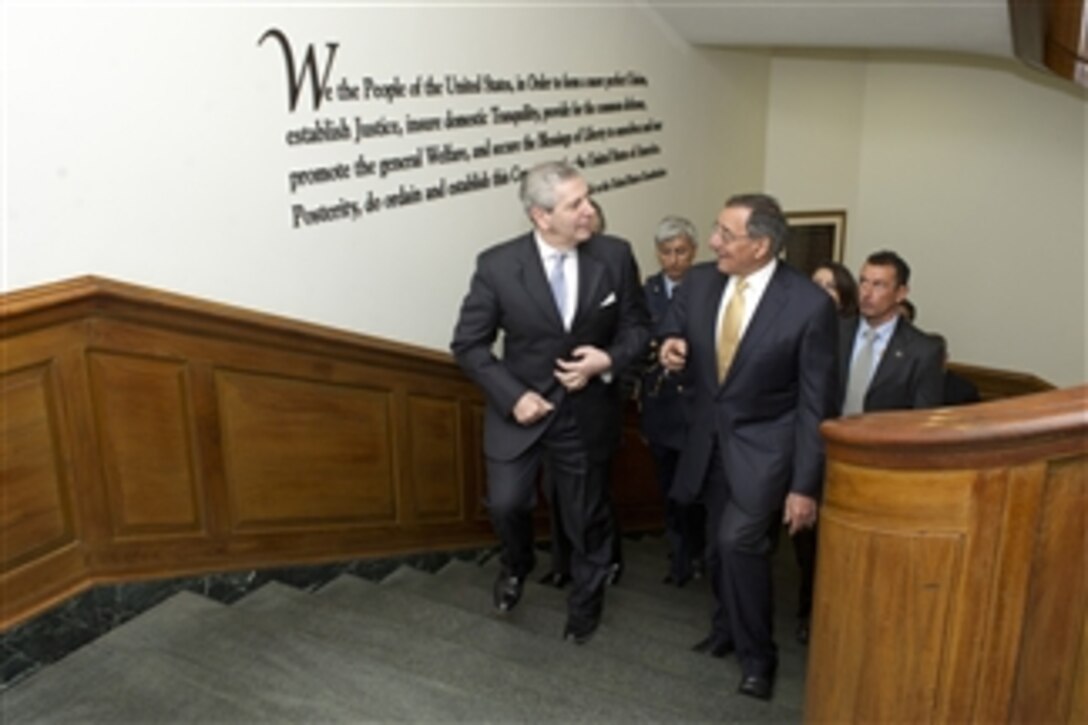 Secretary of Defense Leon E. Panetta (right) escorts Italian Minister of Defense Giampaolo Di Paola to a meeting in the Pentagon on April 30, 2012.  